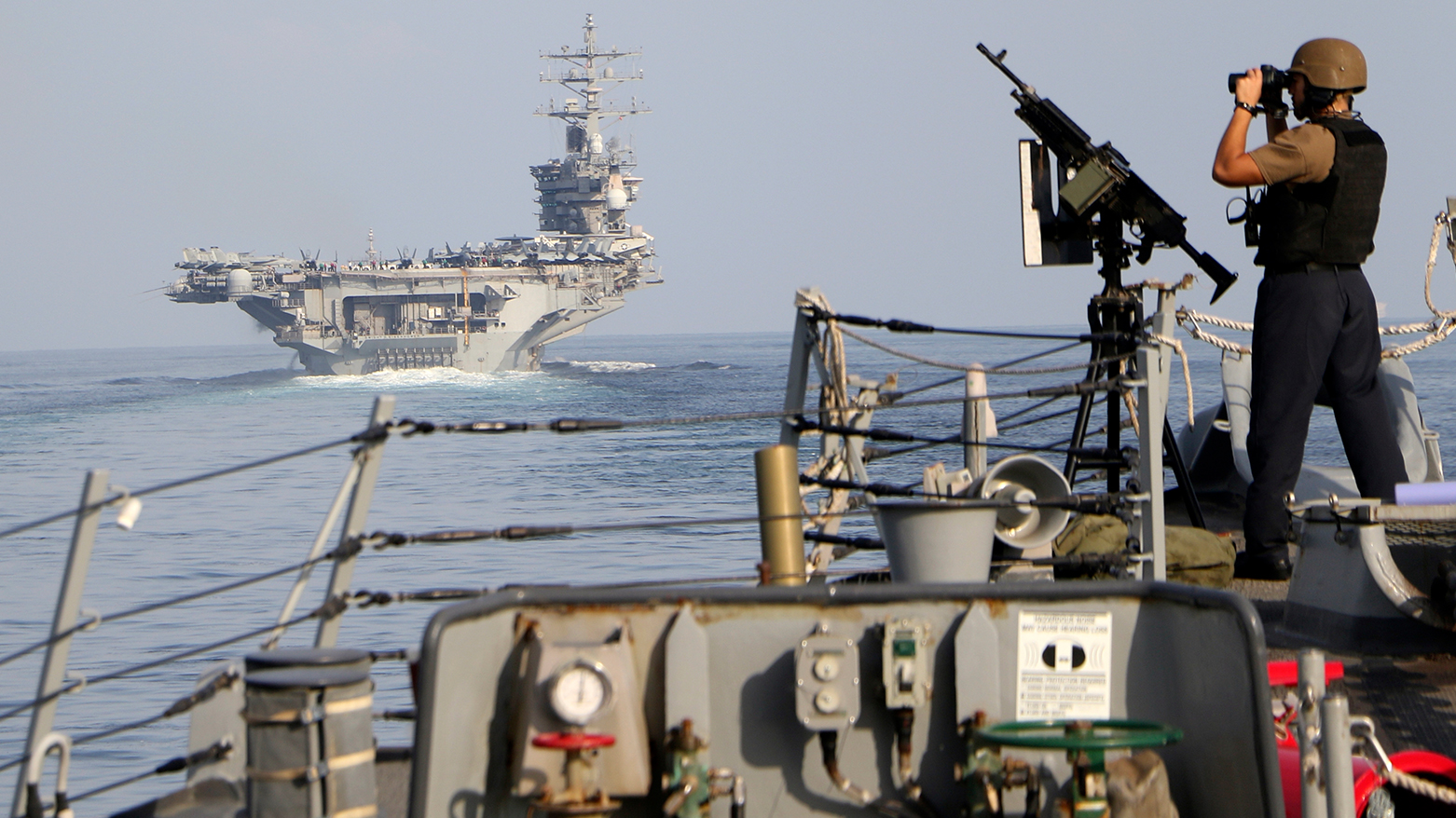 The aircraft carrier USS Dwight D. Eisenhower and other warships crosses the Strait of Hormuz into the Persian Gulf on Sunday, Nov. 26, 2023. (Photo: AP)