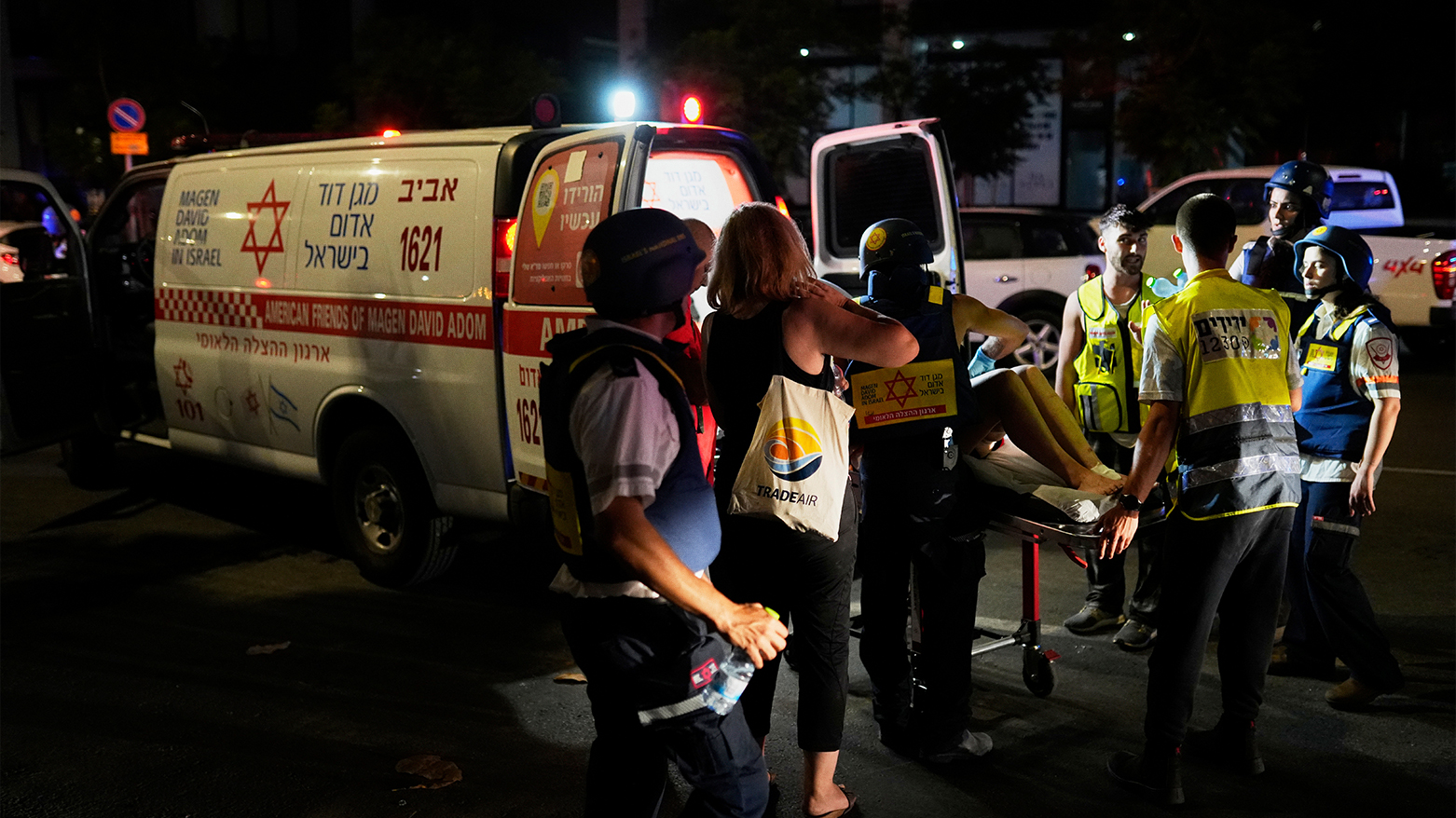Israeli medical personnel assist the wounded in Tel Aviv. (Photo: AP)