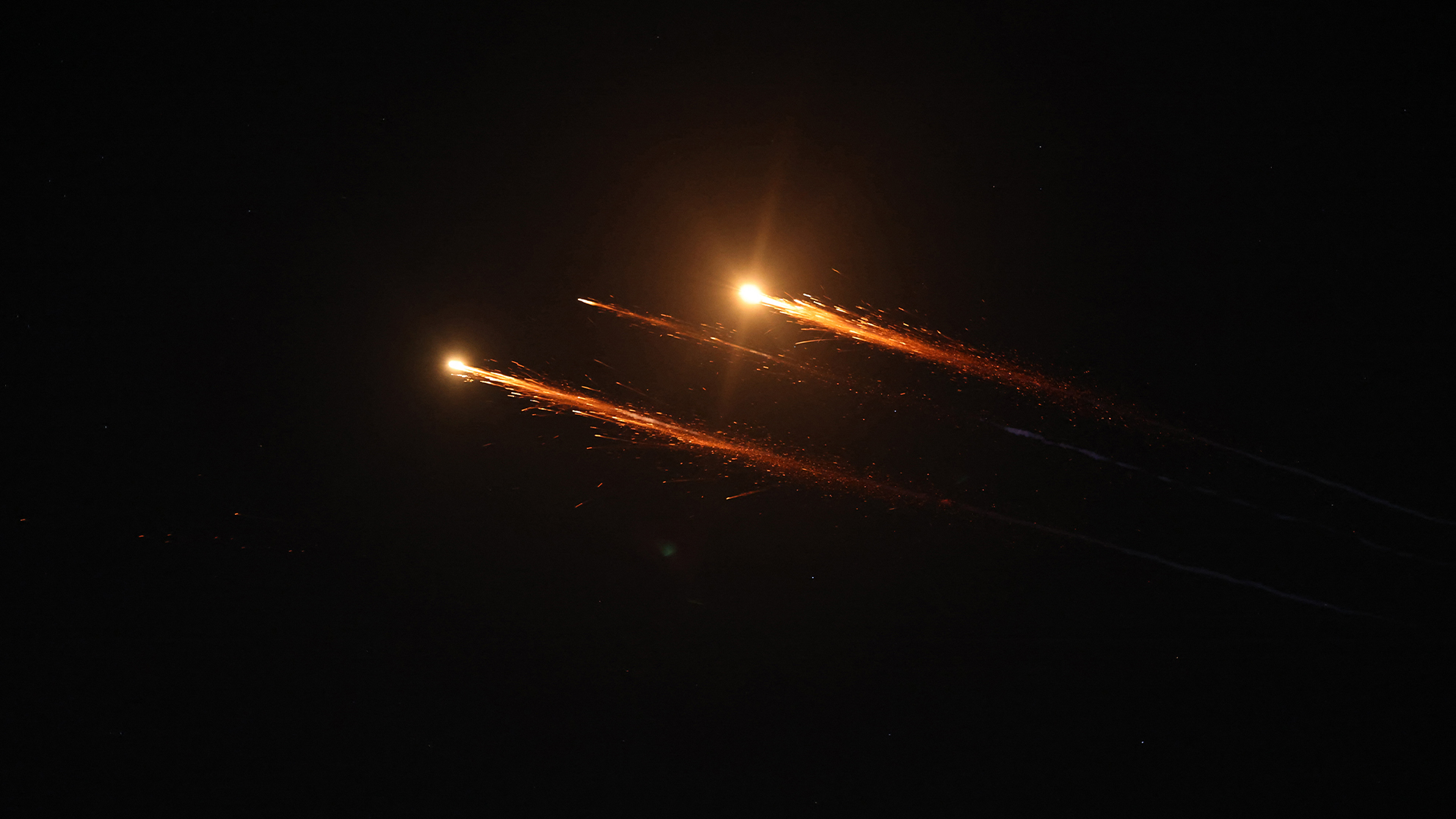 A picture shows rocket trails in the sky above the city of Hebron in the Israel-occupied West Bank amid a fresh barrage of Iranian missiles on June 15, 2025. (Photo: AFP)