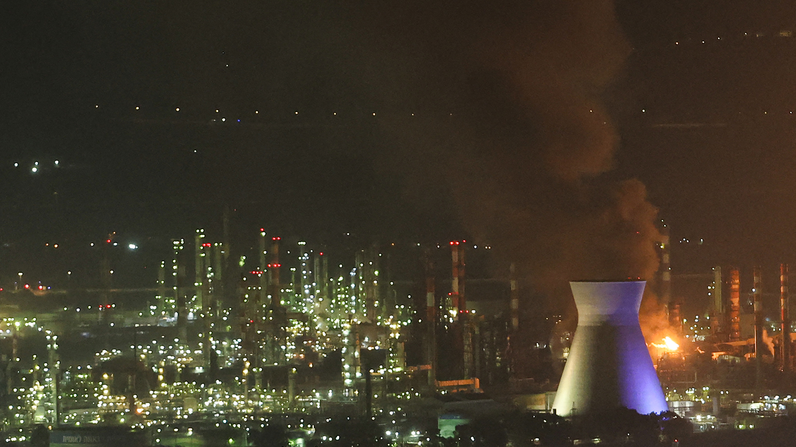 Smoke billows from a site in the city of Haifa on June 16, 2025, following a fresh barrage of Iranian missiles. (Photo: AFP)