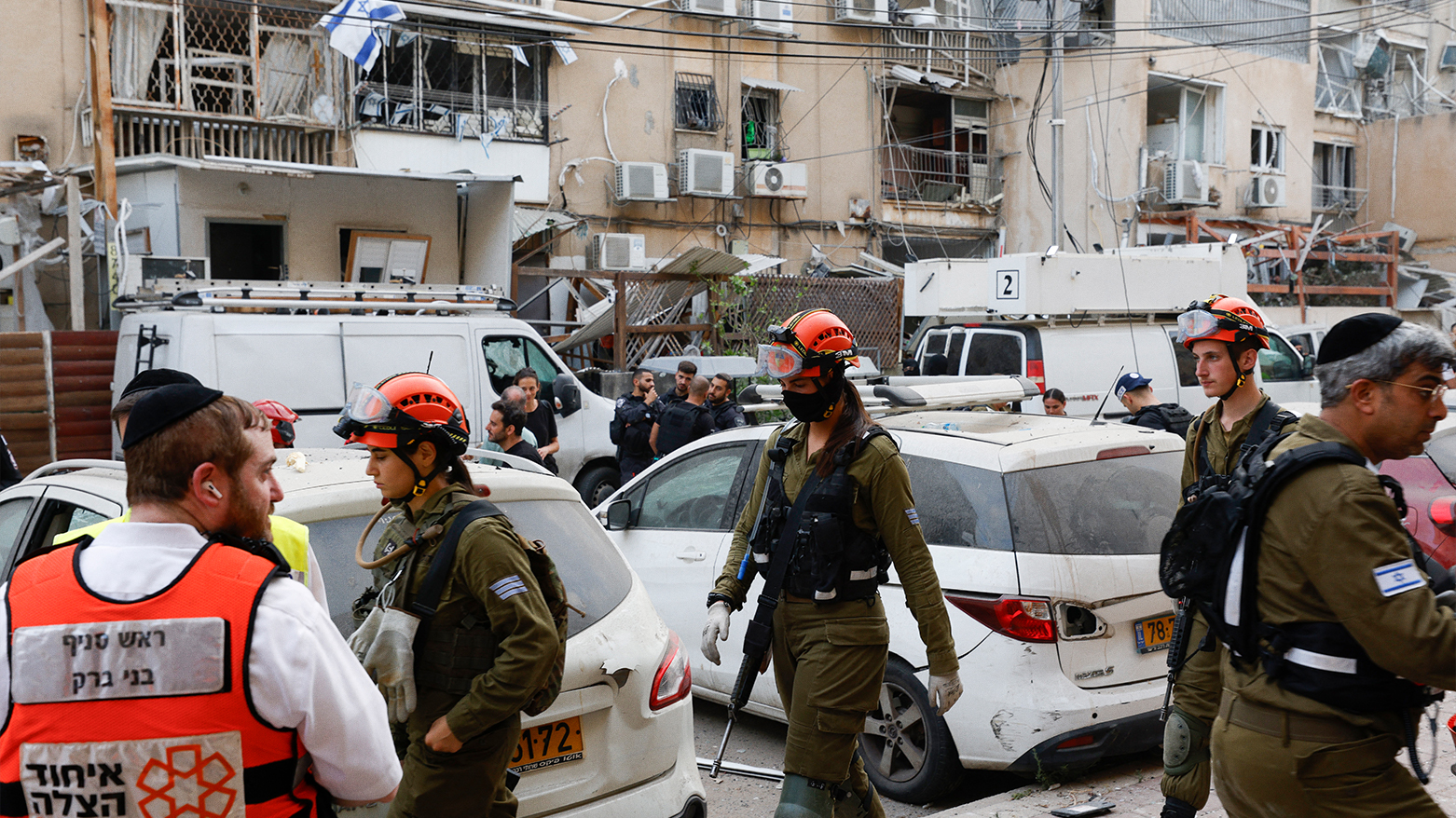Rescuers work near a damaged building following a strike by an Iranian missile in the Israeli city of Bnei Brak. (Photo: AFP)