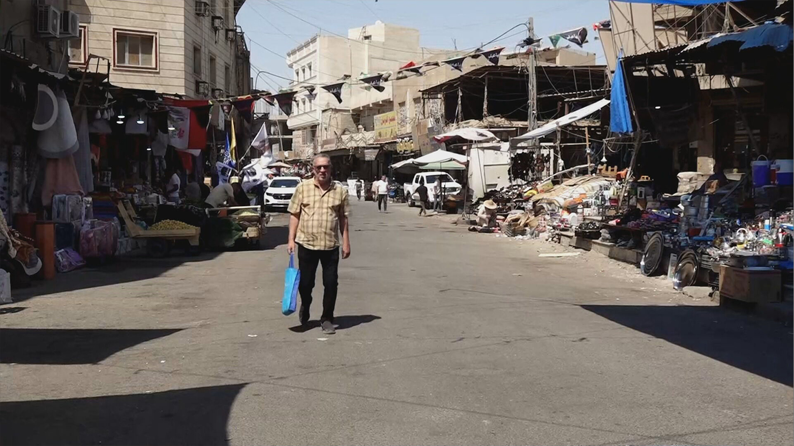 An Iraqi man walking down a marketplace in Basra. (Photo: Kurdistan24)