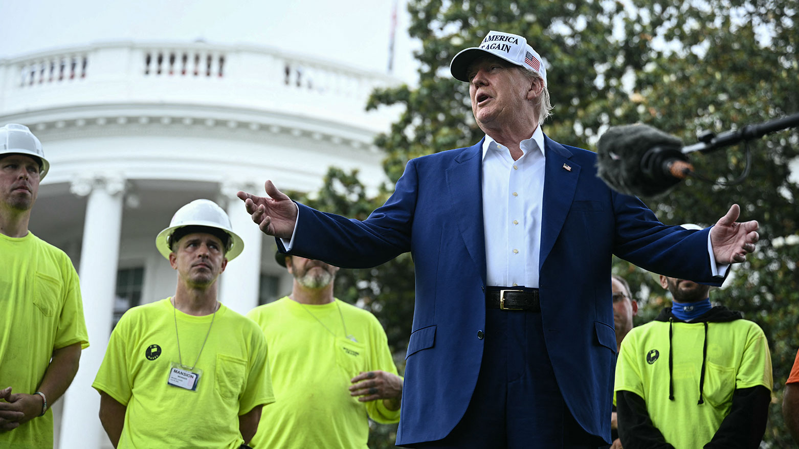 US President Donald Trump speaks to the press as workers install a large flag pole on the South Lawn of the White House in Washington, DC on June 18, 2025. (Photo: AFP)