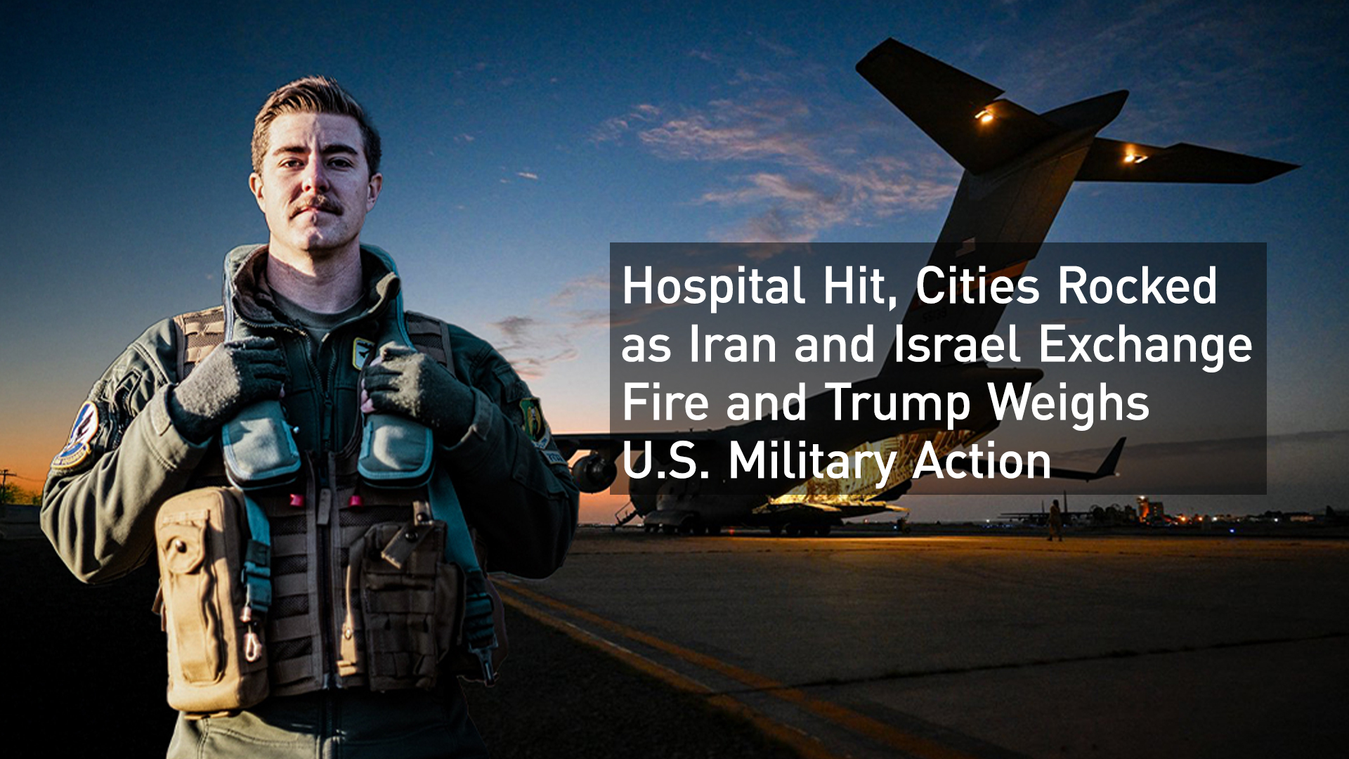 A U.S. military plane is seen behind a standing U.S. solder. (Photo NATO)