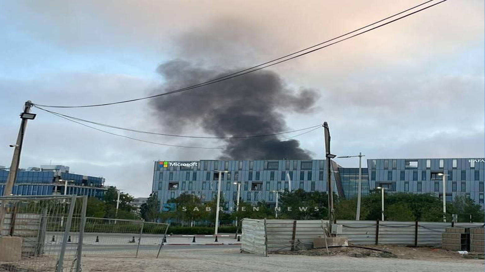 A photo shows smoke rising after an Iranian missile fell near Microsoft in Beersheba. (Photo: Clash report)
