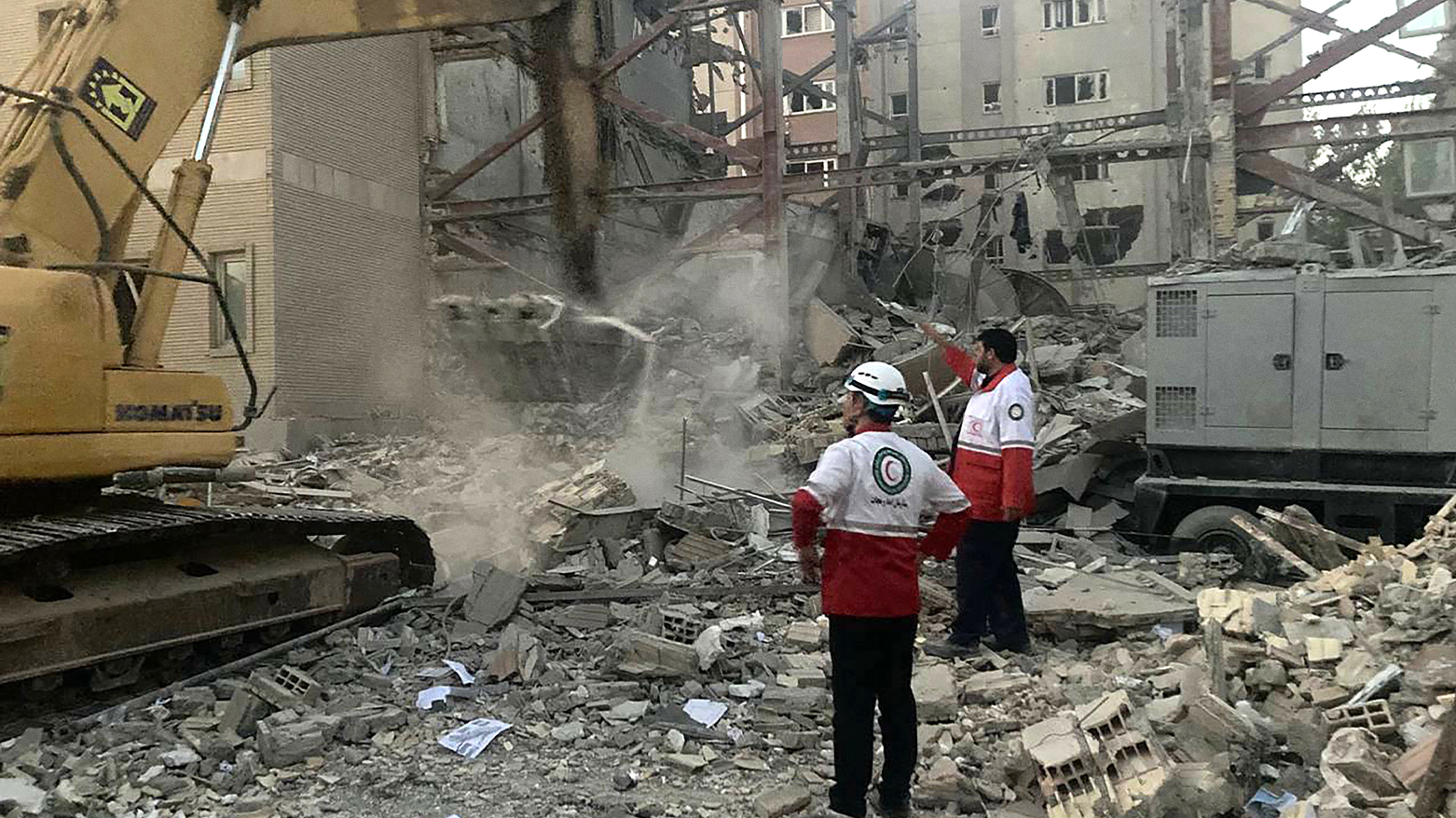 Iranian Red Crescent teams clear debris at a building hit by an Israeli strike in Tehran, June 19, 2025. (Photo: AFP)