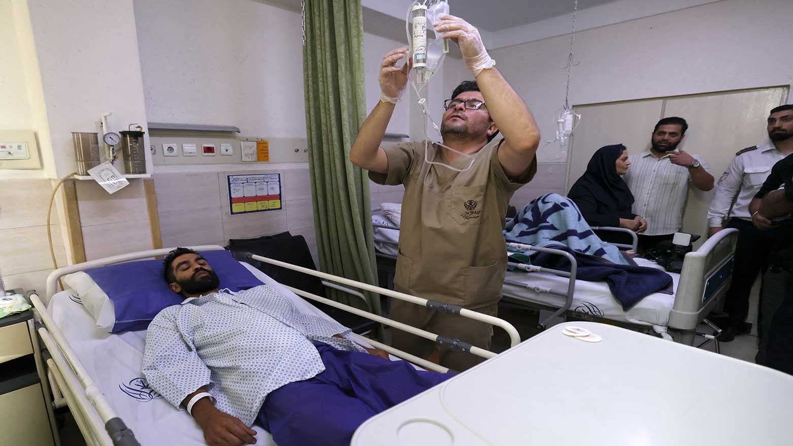 A man injured in an Israeli strike, receives medical care at the Rasoul Akram hospital in Tehran on June 21, 2025. (Photo: AFP)