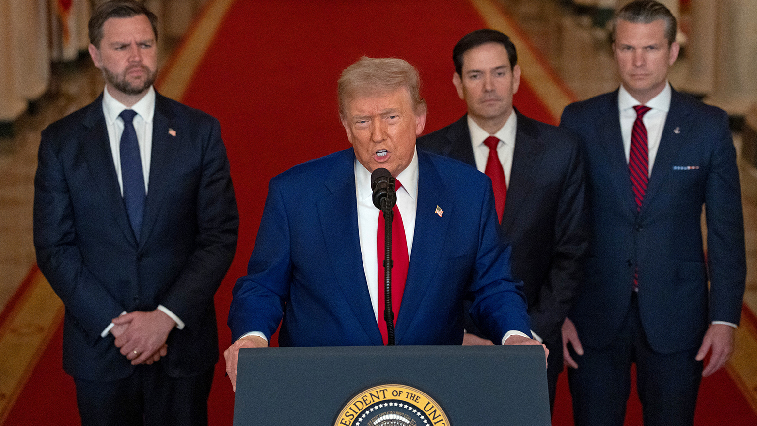 US President Donald Trump addresses the nation, alongside senior members of his cabinet. (Photo: AFP)