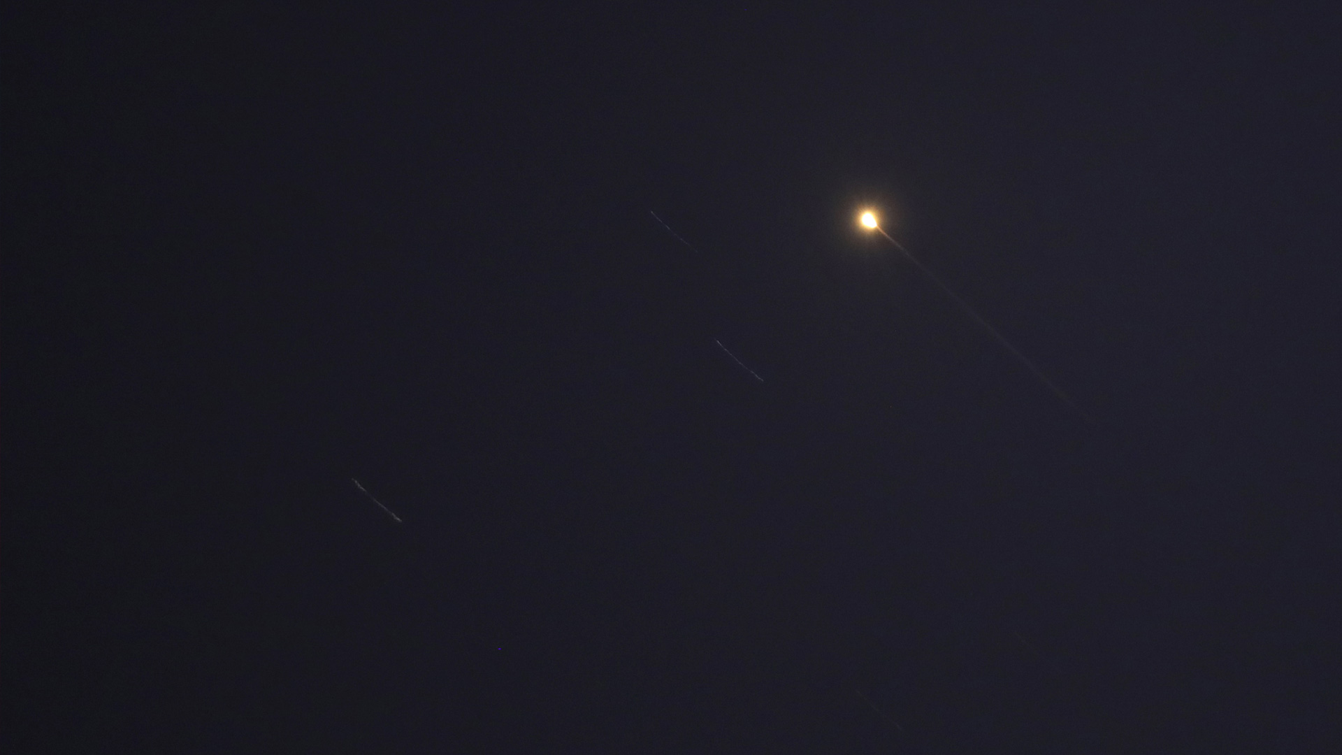 Projectiles are pictured in the sky over Doha, Qatar, on June 23, 2025. (Photo: AFP)
