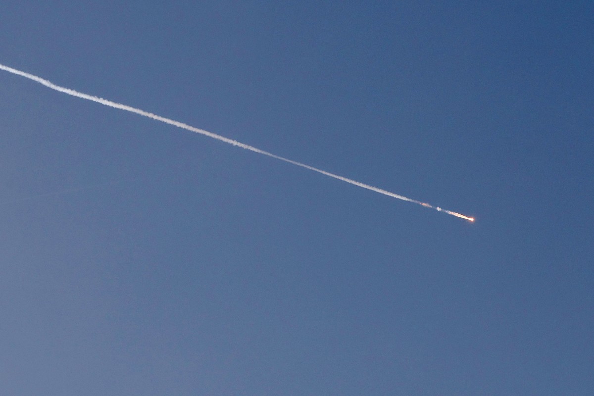 Rocket trails are seen in the sky above the Israeli coastal city of Netanya. (Photo: AFP)