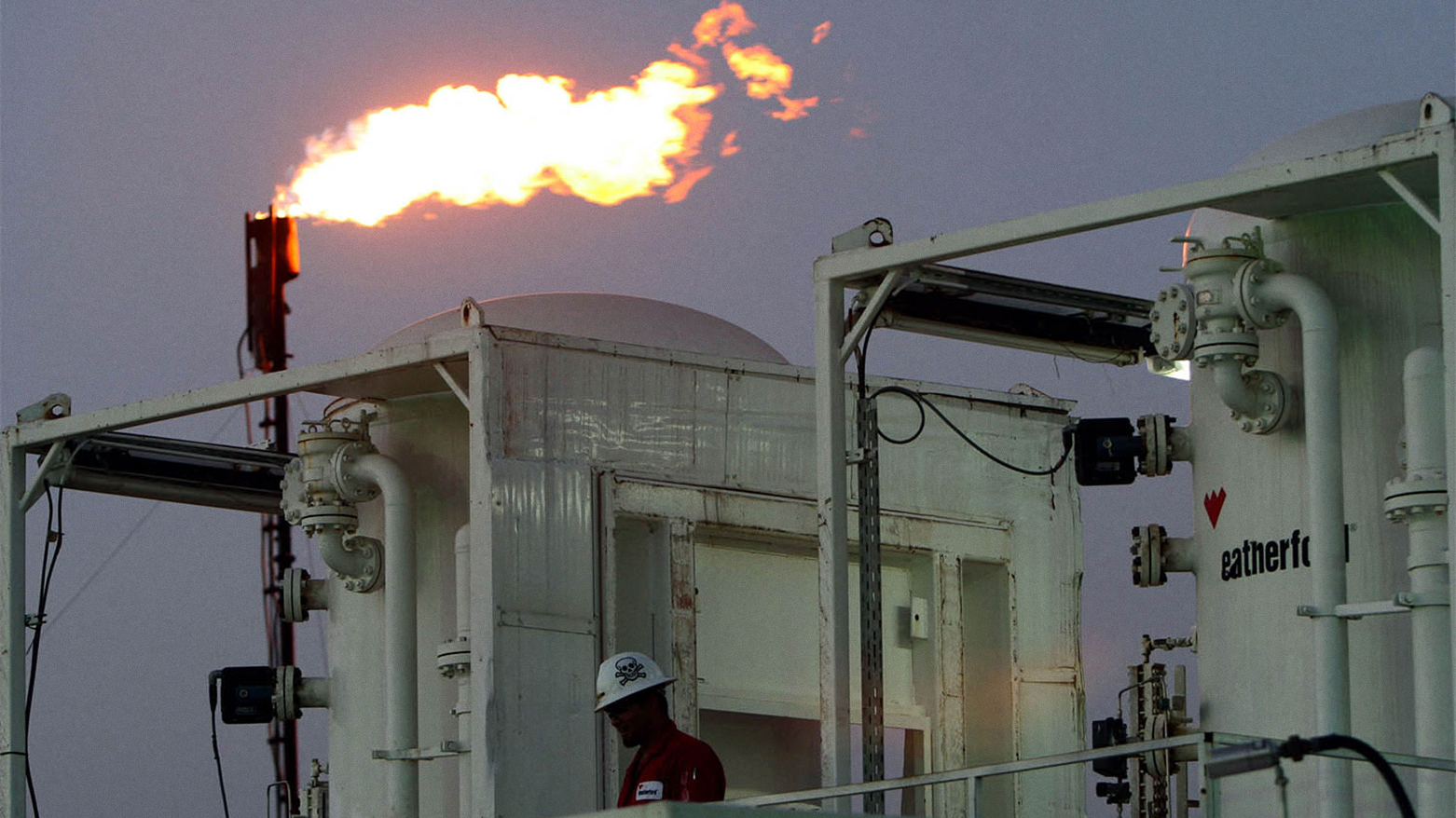 A worker is seen at an oil refinery near the district of Taq Taq. (Photo: AFP)
