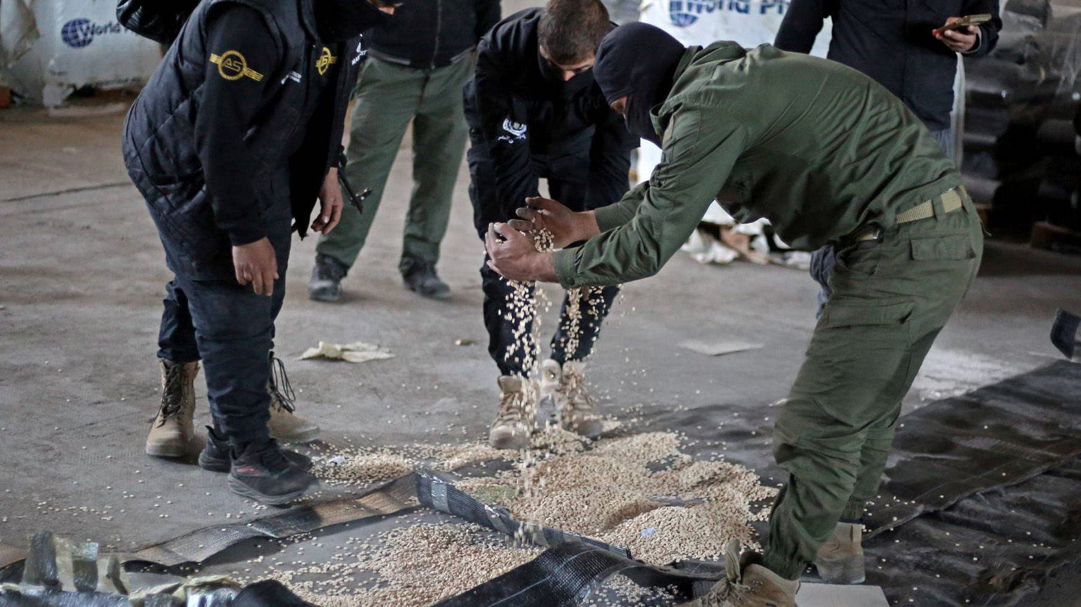 Members of the security forces with Syria's new government inspect a warehouse that used to hide pills of Captagon, inside children's toys, hookahs, house doors and plastic insulation, during a raid in Latakia on Jan. 19, 2025. (Photo: AFP)