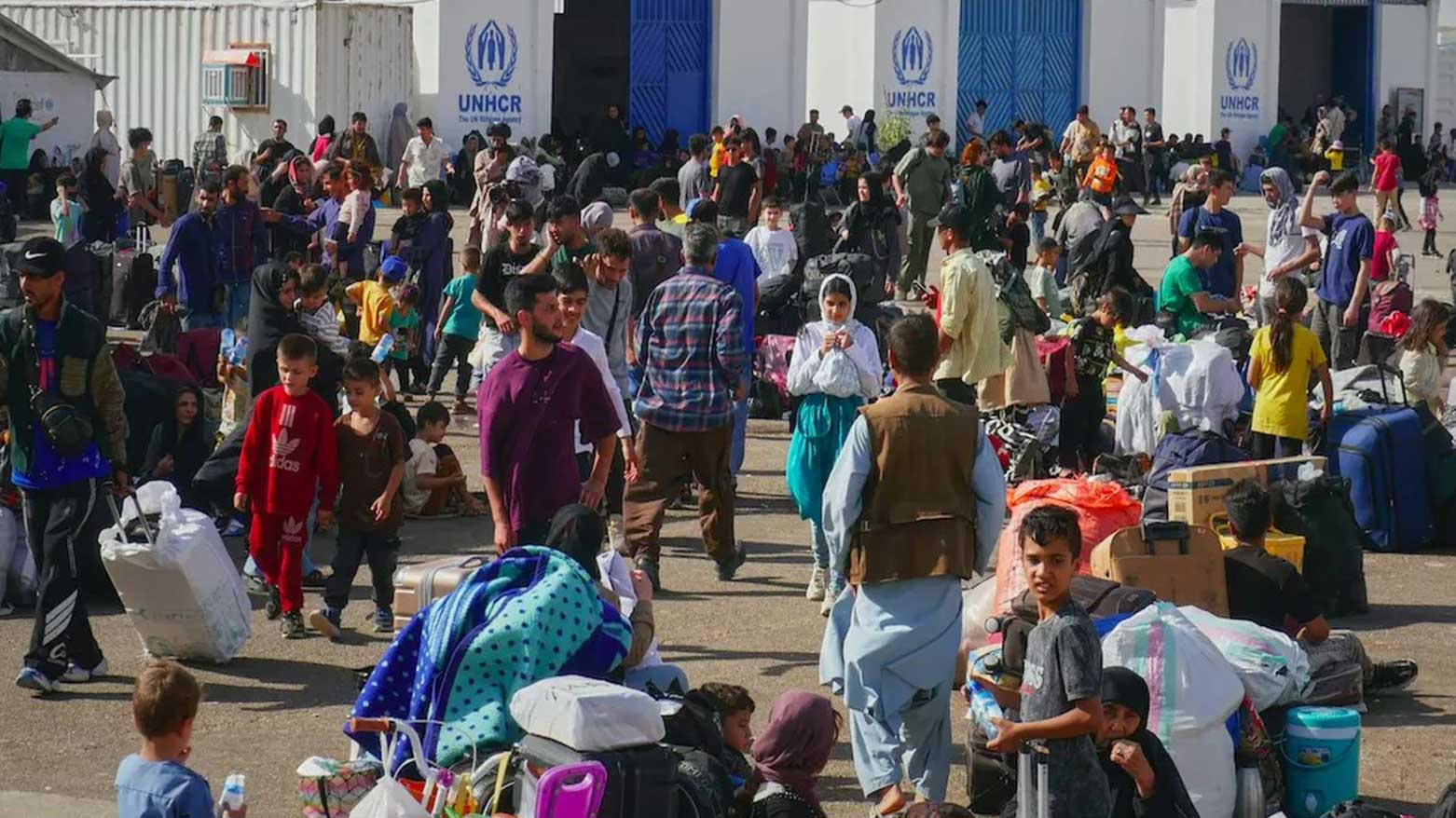 Afghan refugees who returned after fleeing Iran to escape deportation and conflict gather at a UNHCR facility near the Islam Qala crossing in western Herat province, Afghanistan, June 20, 2025. (Photo: AP)