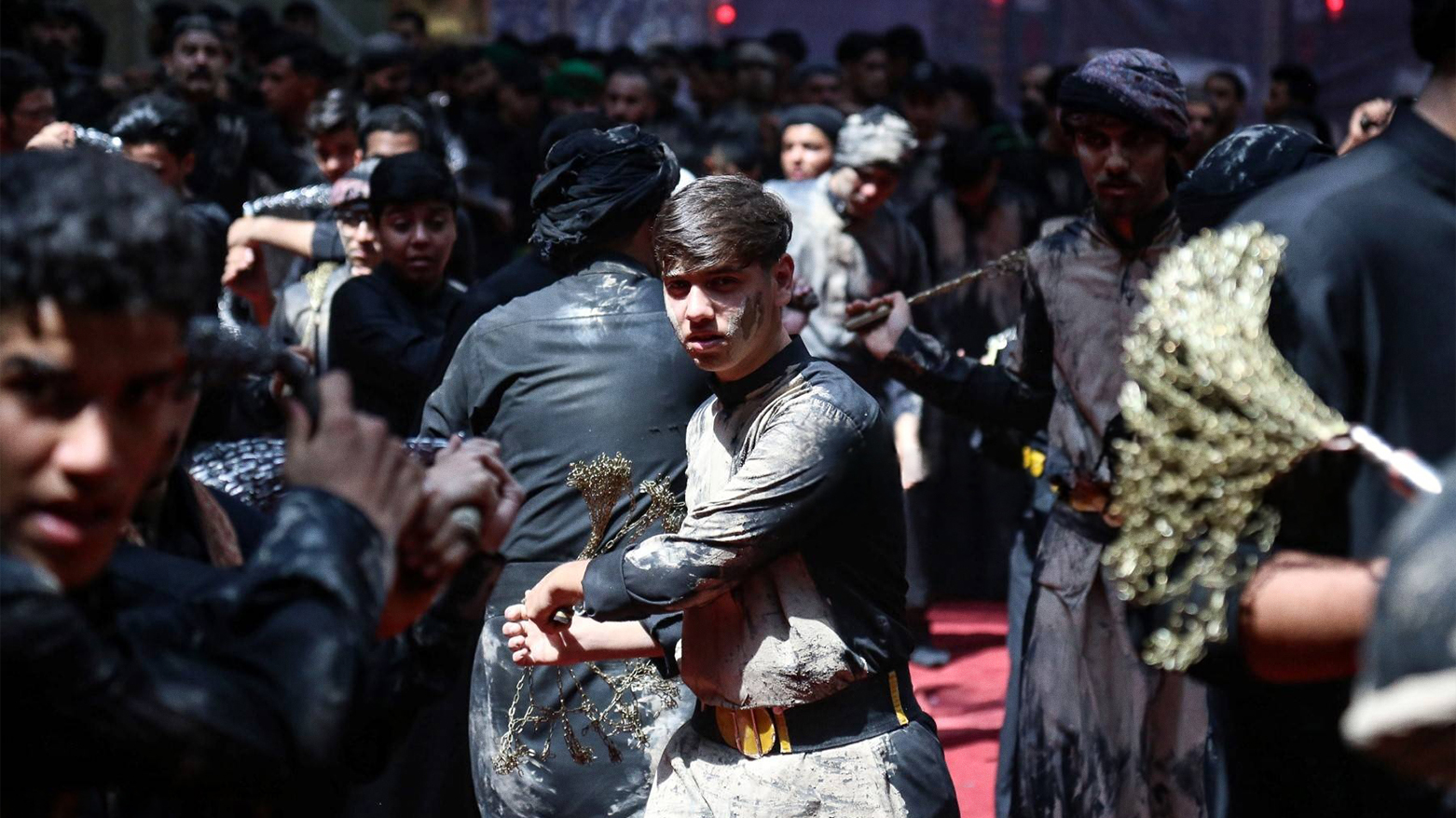Shiite Muslims self-flagellate with chains during the Ashura mourning rituals in Karbala, on July 28, 2023. (Photo: AFP)