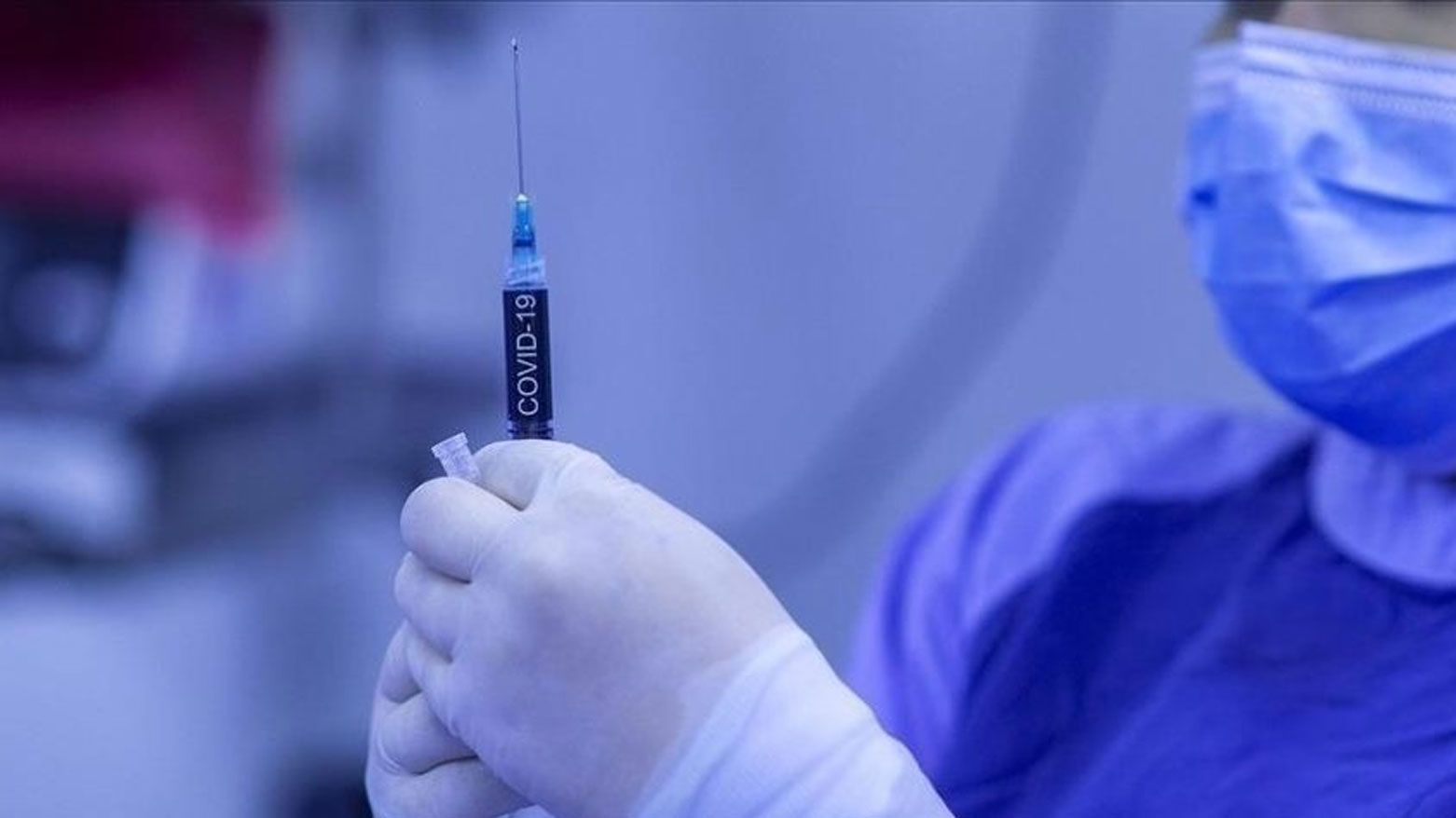 A nurse holding a syringe labeled "COVID-19". (Photo: Social Media)