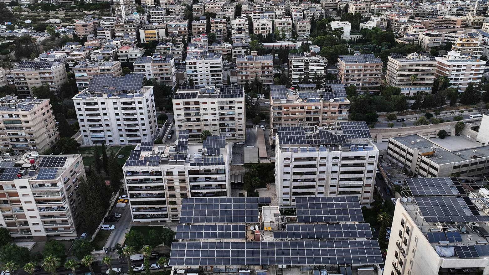 An aerial view shows solar panels installed on building rooftops in Damascus, Syria, June 30, 2025. (Photo: AP)
