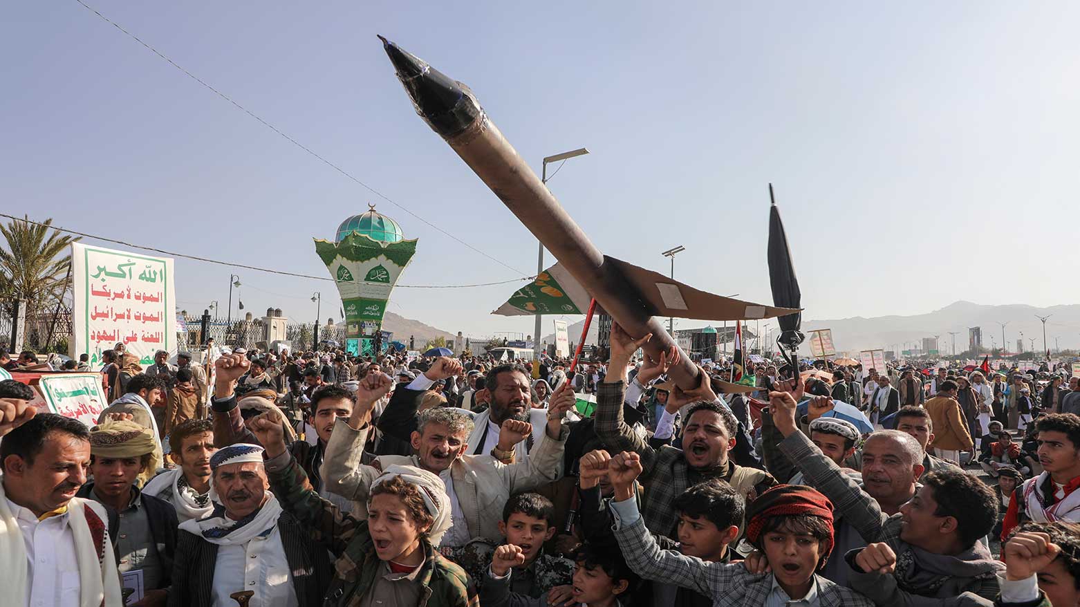 Houthi supporters carry a mock rocket and chant slogans during an anti-Israel rally in Sanaa, Yemen, Dec. 27, 2024. (Photo: AP)