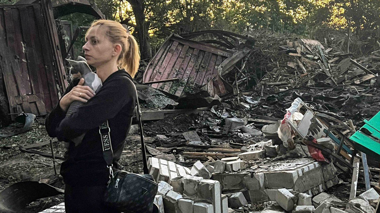 A woman holding her cat next to a destroyed house following a Russian drone attack in Vyshgorod district, Kyiv region, July 6, 2025. (Photo: AFP)