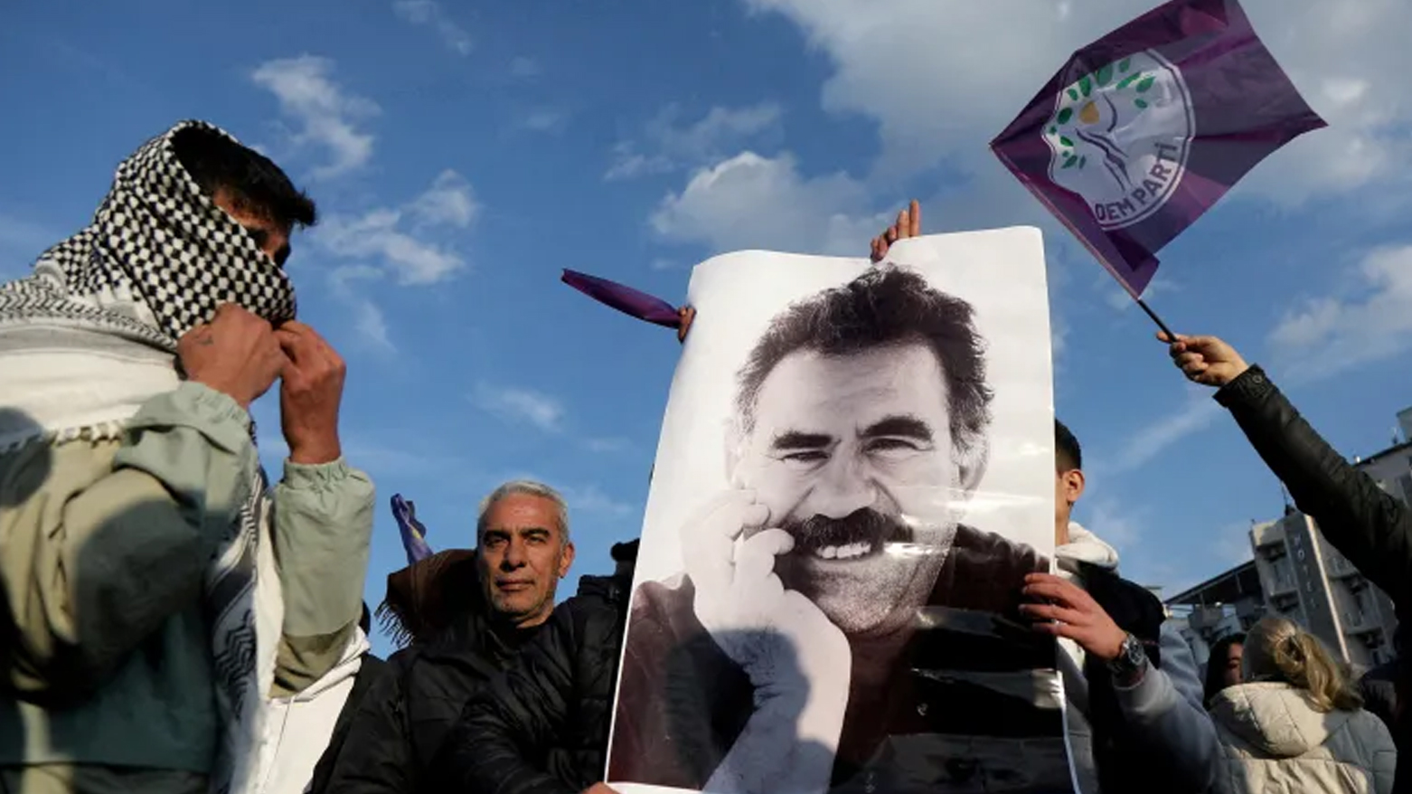 A demonstrator holds a picture of jailed Kurdish leader Abdullah Ocalan during a rally in Diyarbakir, Turkiye, on Feb. 27, 2025. (Photo: Reuters)