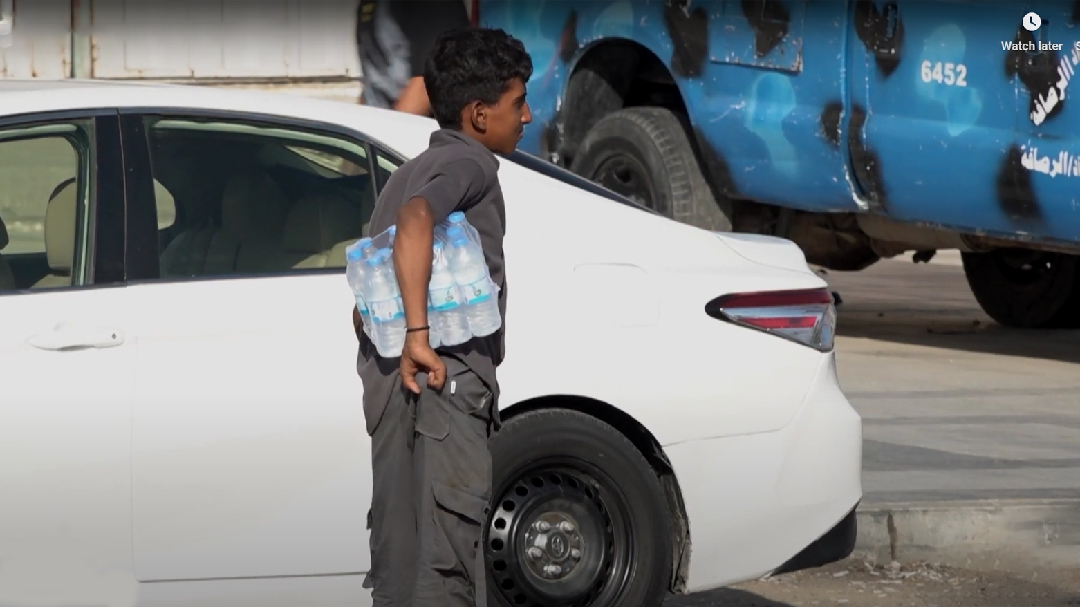 The image of a child in Baghdad selling water on the street. (Photo: Kurdistan24)