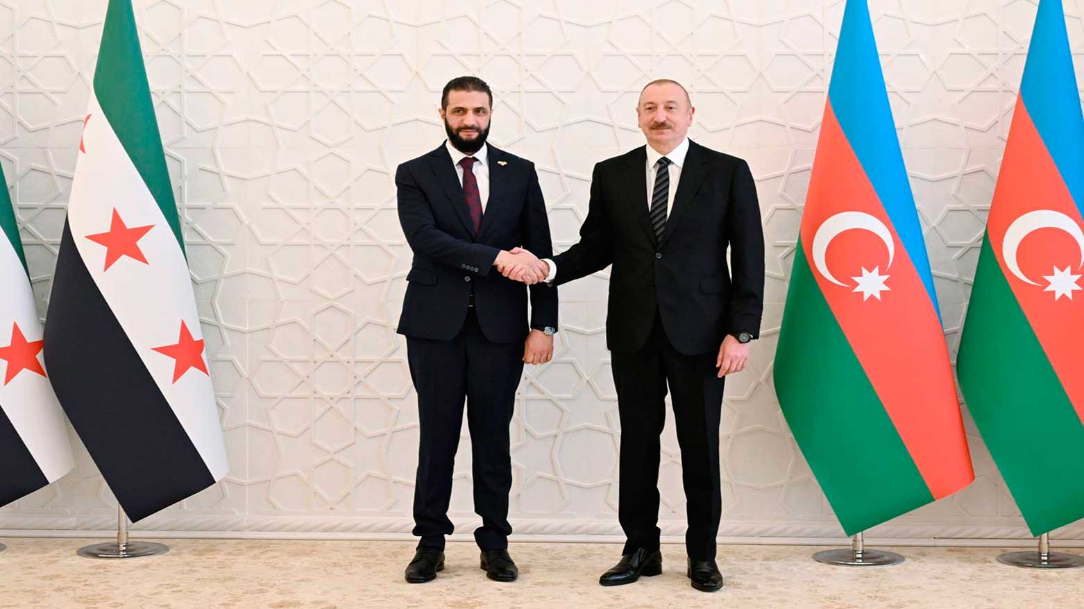 Azerbaijani President Ilham Aliyev, (R), welcomes Syria’s interim President Ahmad Al-Sharaa, in Baku, Azerbaijan, July 12, 2025. (Photo: AP)