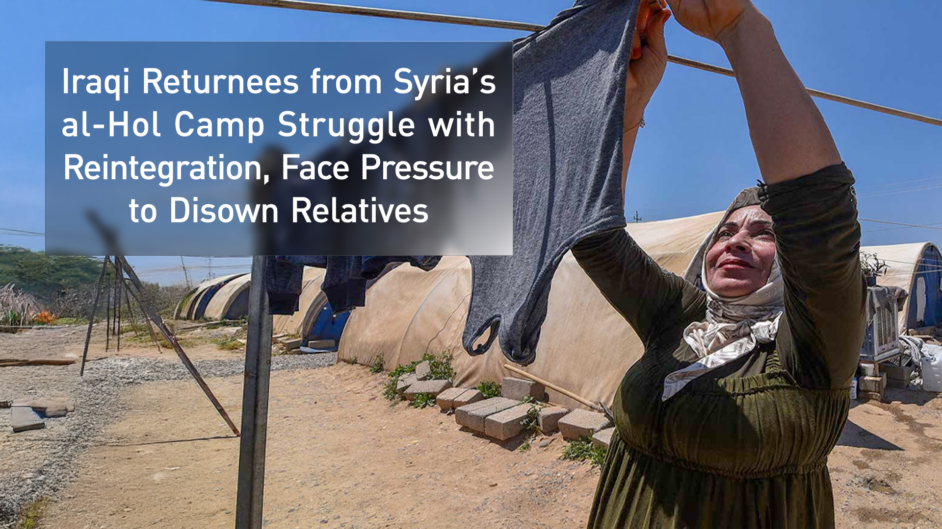 A woman hangs laundry at the Al-Amal Camp (formerly Al-Jadaa), south of Mosul in northern Iraq, which houses Iraqi families who have been repatriated from Syria's Al-Hol camp, on May 8, 2025. (Photo: AFP)