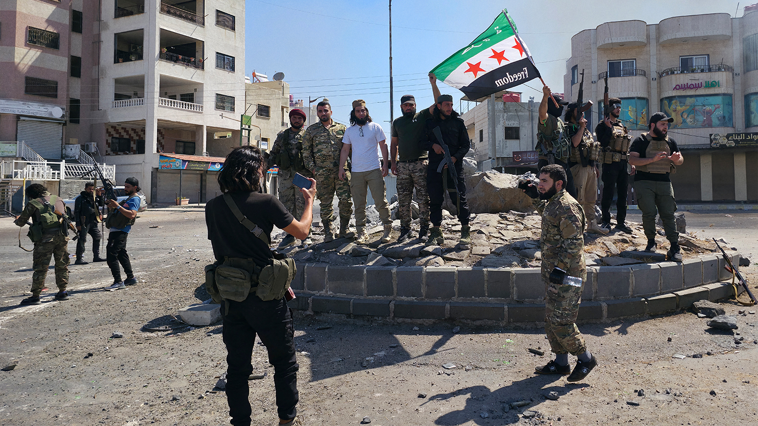 Syria's security forces pose for a picture on a roundabout in the predominantly Druze city of Suwayda on July 15, 2025. (Photo: AFP)