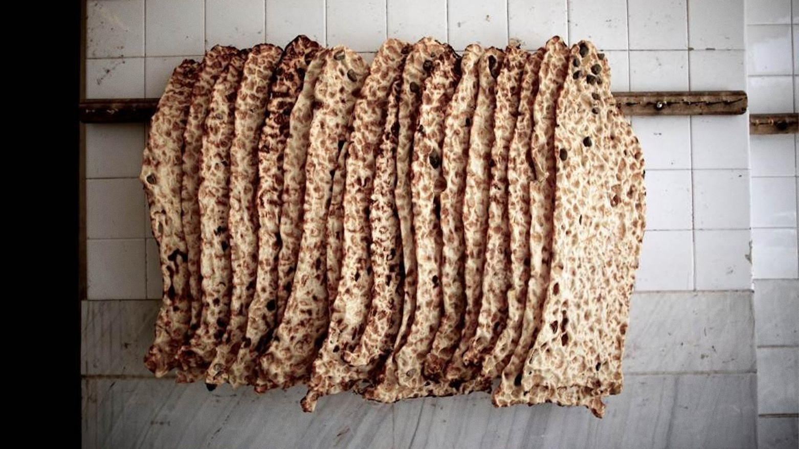 Iranian traditional "Sangak" bread is seen hanging at a bakery in the religious Shiite city of Qom. (Photo: AFP)