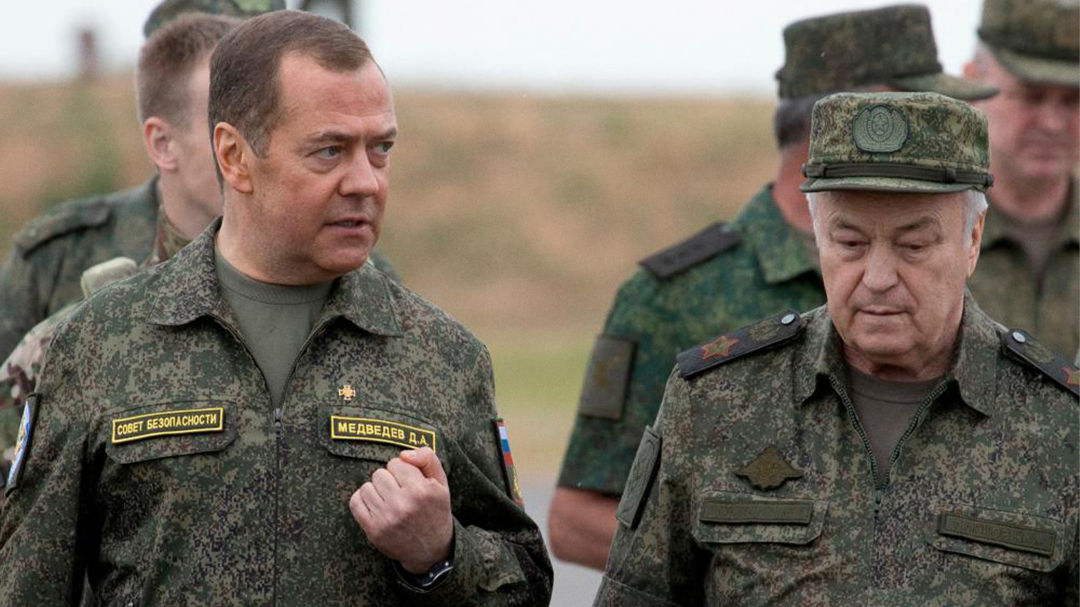 Russia's Deputy head of the Security Council Dmitry Medvedev, accompanied by Deputy Defence Minister Nikolay Pankov. (Photo: AFP)