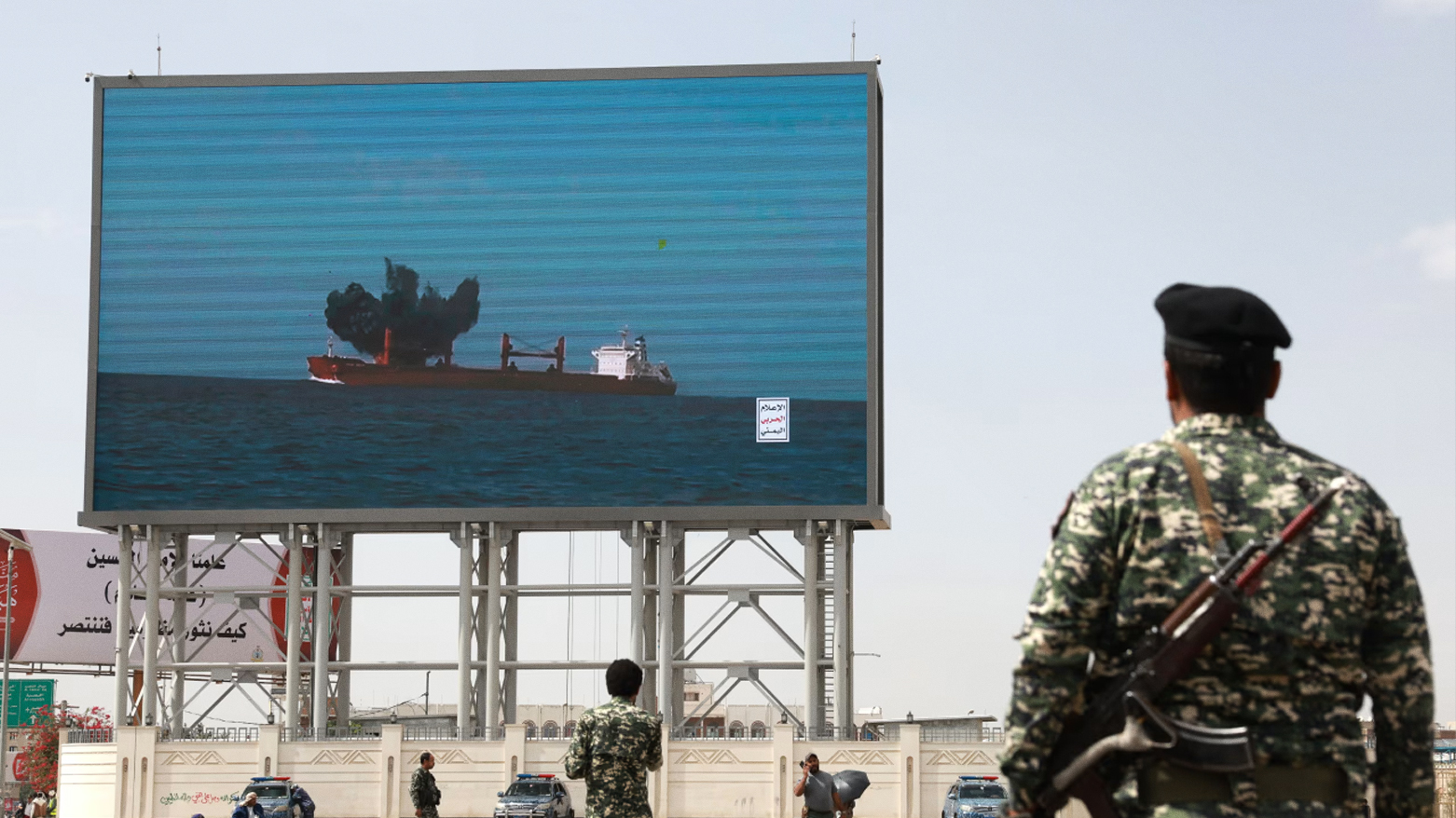 A digital billboard in Sana’a, Yemen, displays a Houthi attack on a cargo ship in the Red Sea, July 2025. (Photo: WSJ)