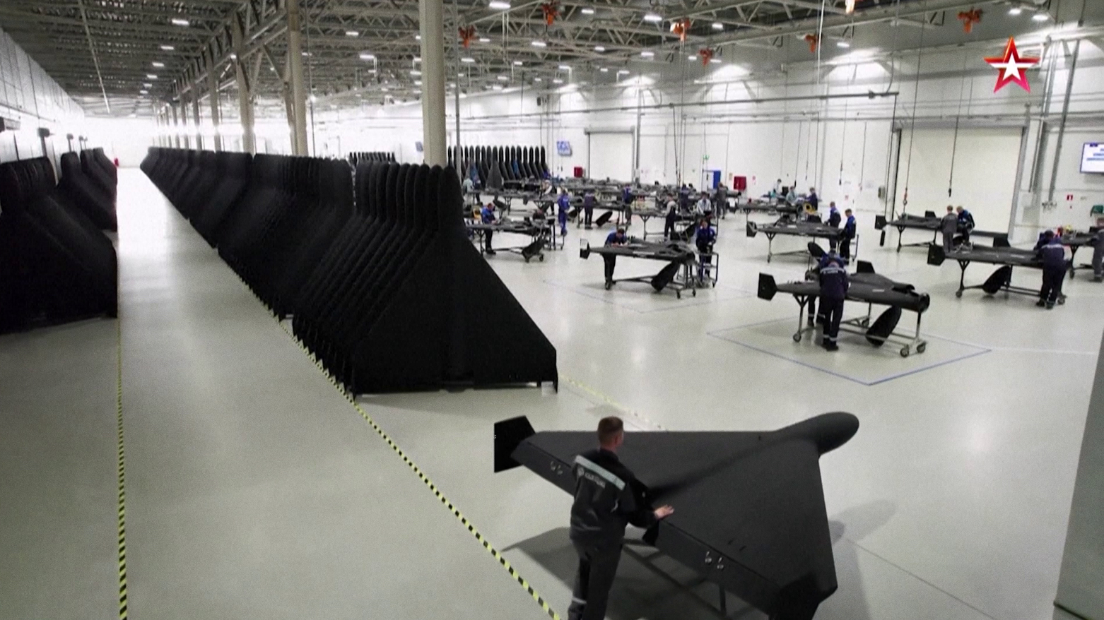 Screenshot from Russian state TV shows attack drones being assembled at what it calls the world’s largest drone factory. (AFP)