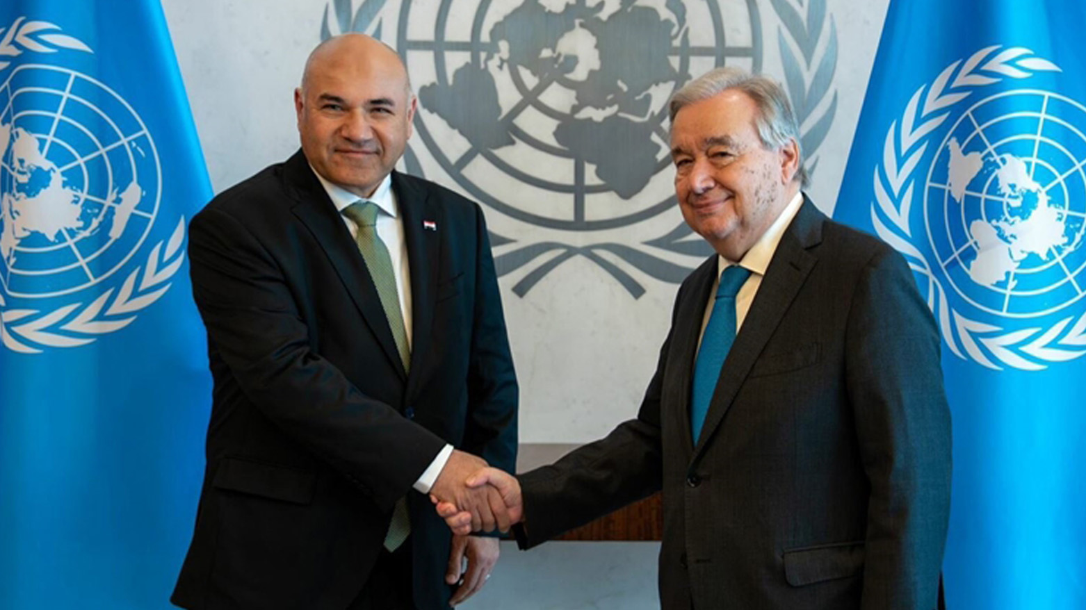 Lukman Faily, the new Permanent Representative of Iraq to the UN (left), shaking hands with UN Secretary-General António Guterres, July 24, 2025. (Photo: UN)