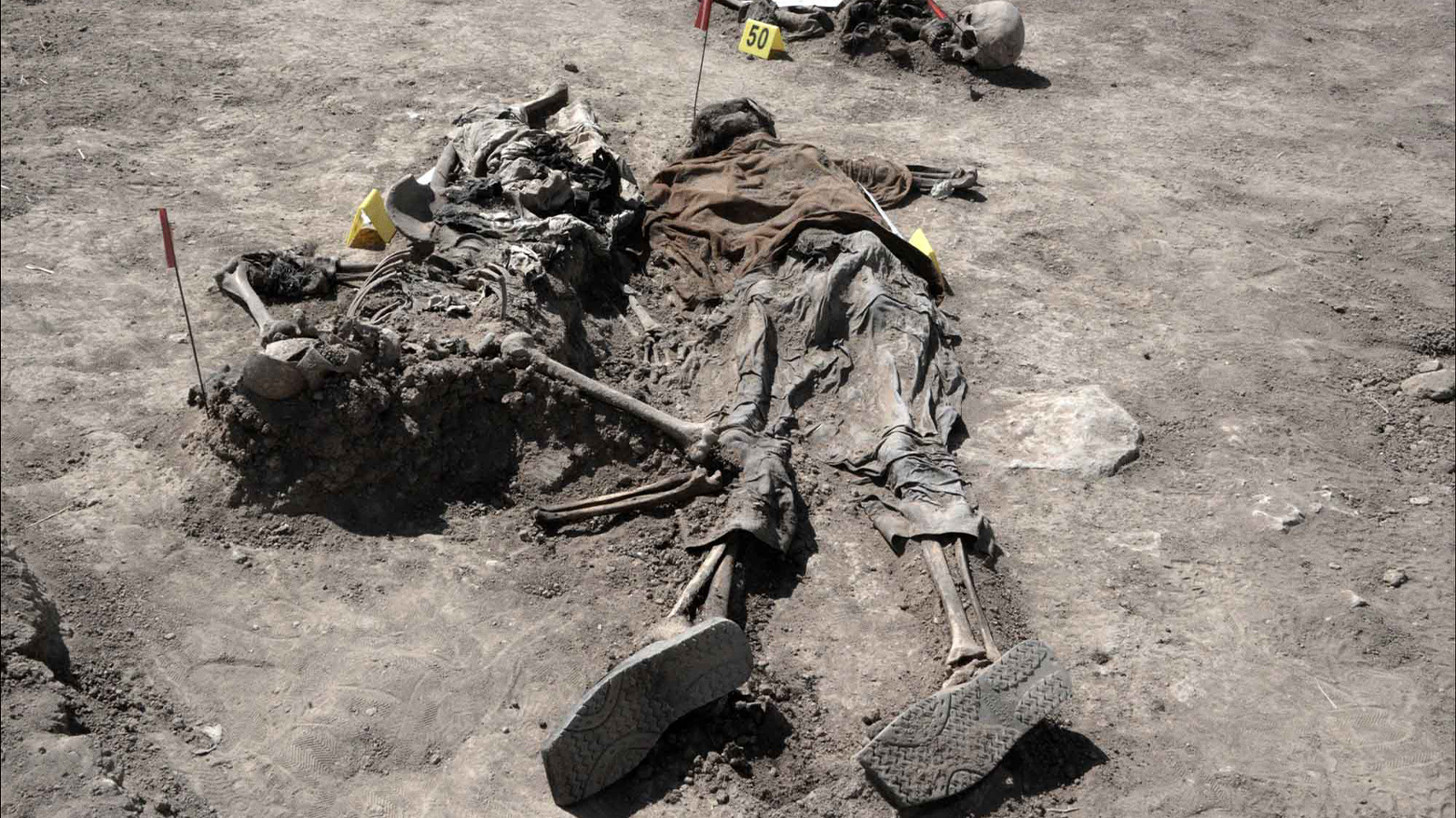 Graphic content / Human remains, reportedly of victims of the 2014 Badush prison massacre committed by ISIS. (AFP)