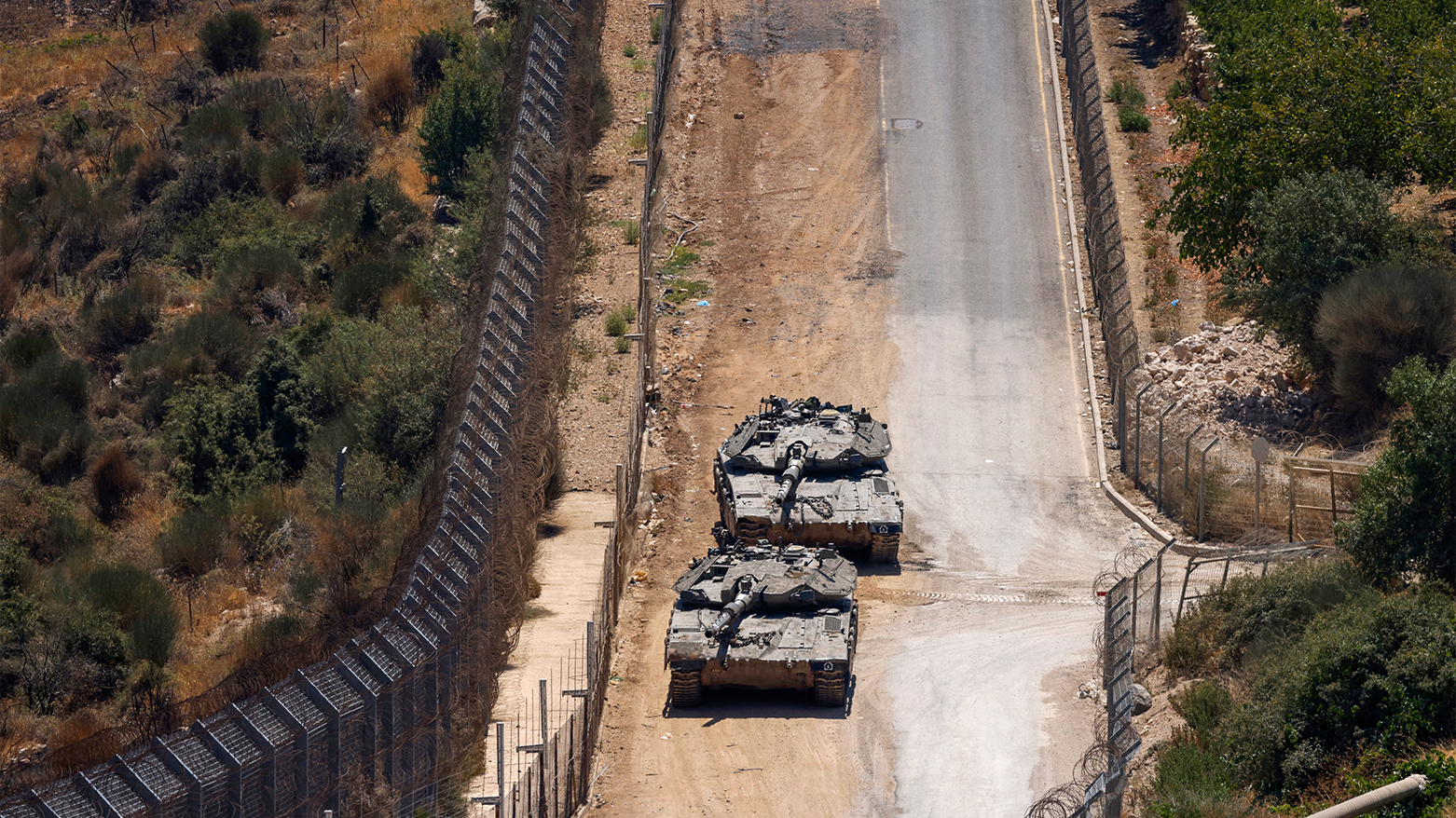 Israeli troops patrol the border fence with Syria near the Druze village of Majdal Shams in the Golan Heights on July 23, 2025. (AFP)