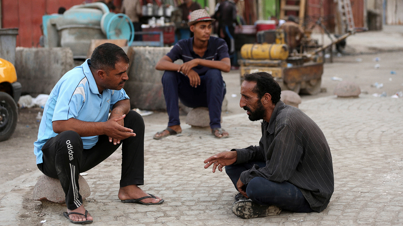 The photo shows construction workers looking for jobs in Baghdad, Iraq. (AP)