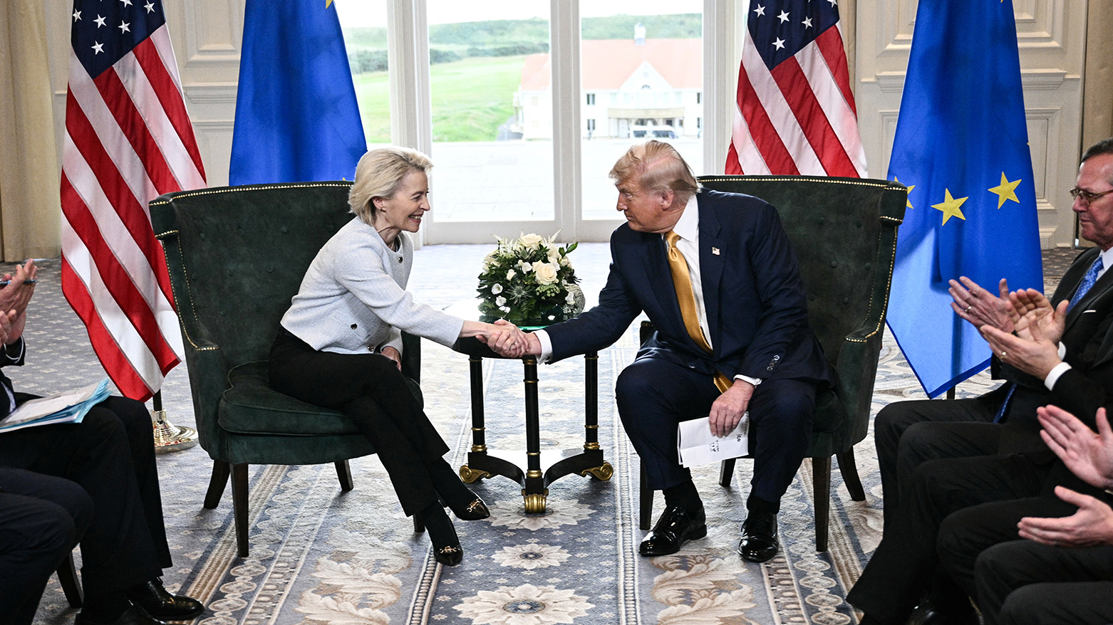 US President Donald Trump (R) shakes hands with European Commission President Ursula von der Leyen (L) after agreeing on a trade deal between the two economies, in Scotland on Jul. 27, 2025. (Photo: AFP)
