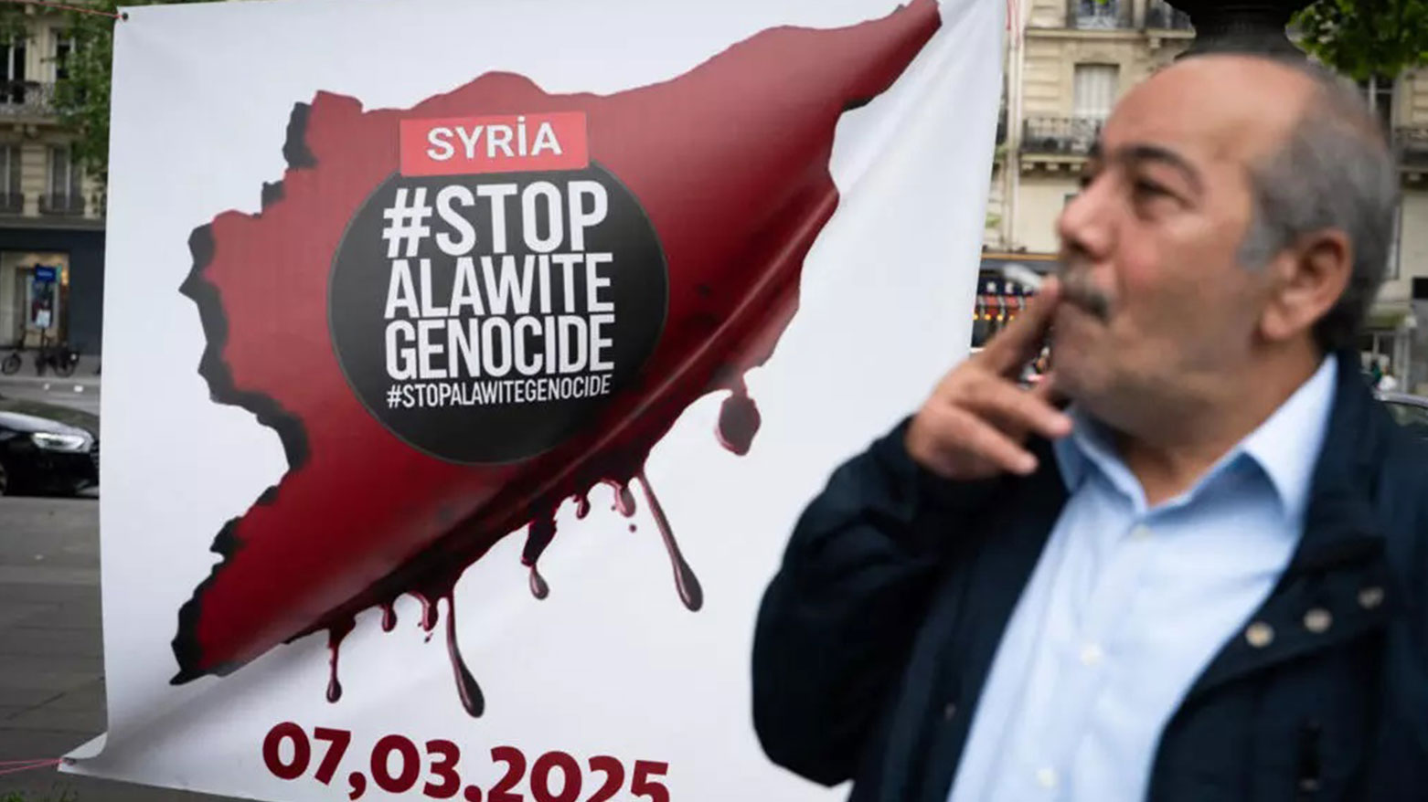 A man takes part in a demonstration at Place de la République organised by Kurd, Alawite and Druze minority groups of Syria, protesting the visit of Syria's interim President,in Paris on May 7, 2025. (Photo: AFP)