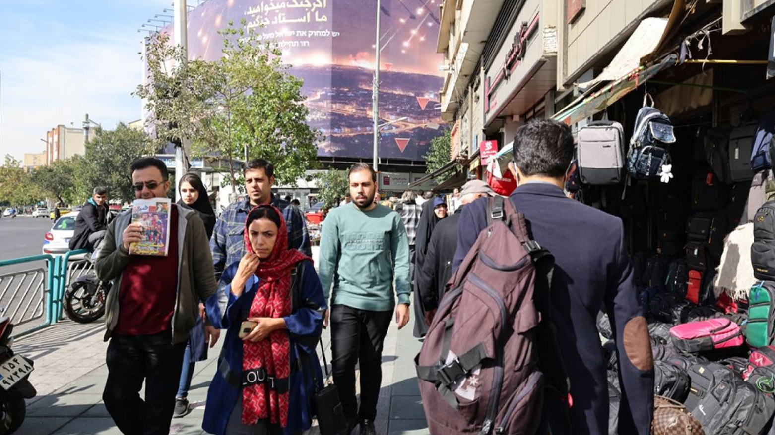 People walk along a street in Tehran on October 26, 2024. (Photo: AFP)