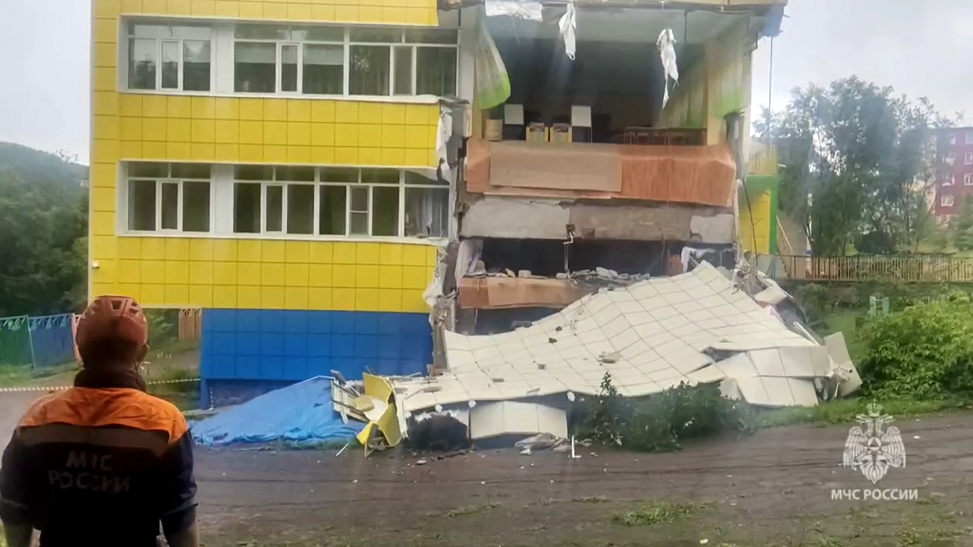 This video grab from a footage released by Russia's Emergencies Ministry, shows emergency service specialists inspecting a kindergarten damaged by an earthquake in Petropavlovsk-Kamchatskyi, Russia, July 30, 2025.