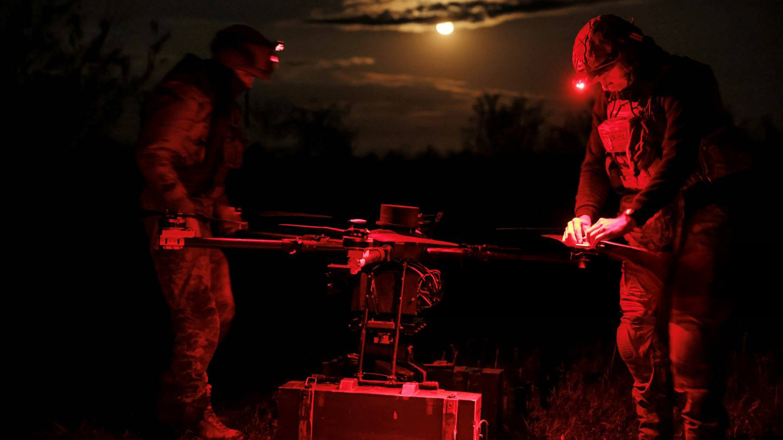 Released on May 16, 2025 by the press service of the 24th Mechanized Brigade of Ukrainian Armed Forces, Ukrainian servicemen prepare to fly a 'Kazhan' drone. (Photo: AFP)