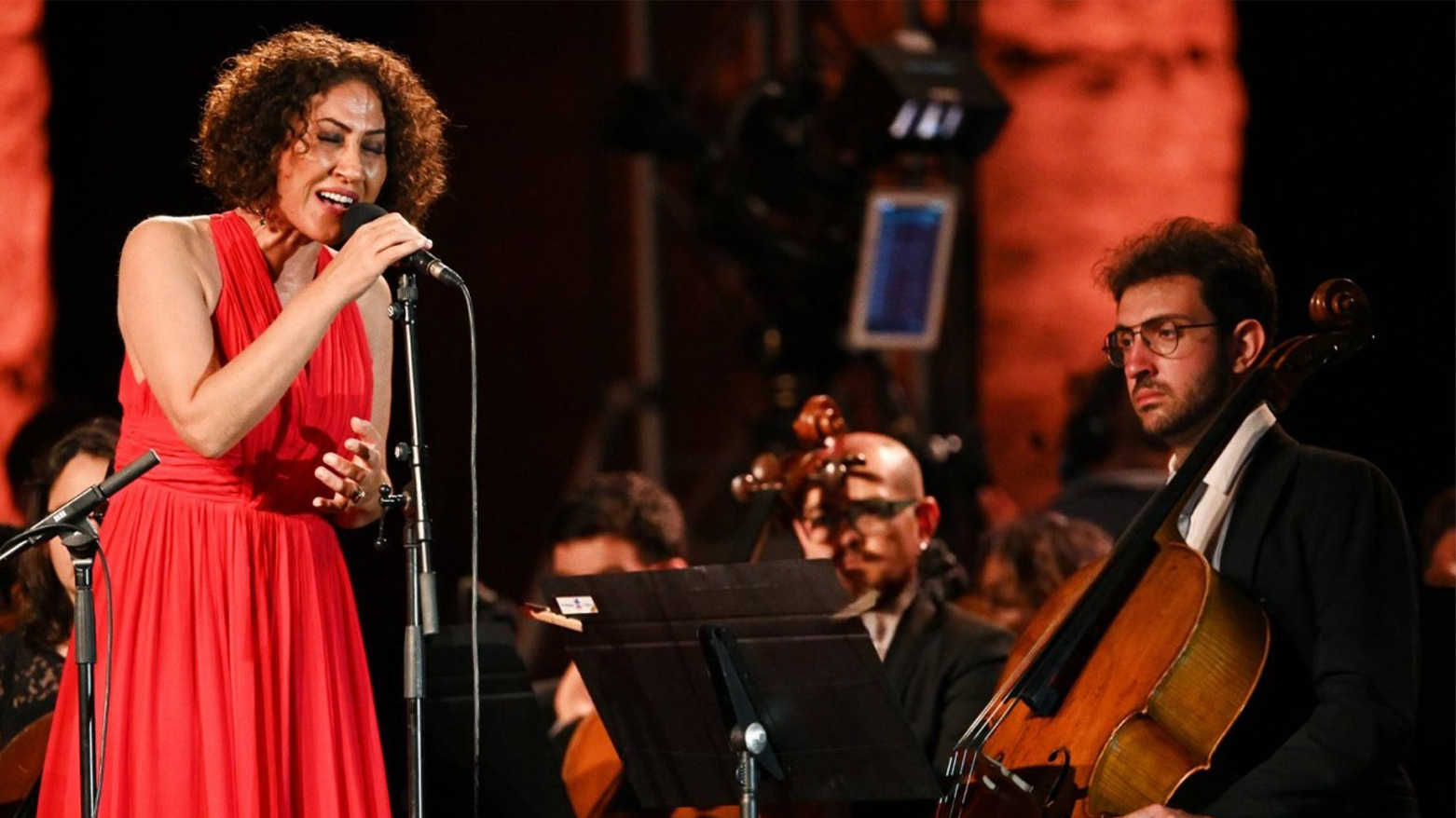 Kurdish singer Aynur Dogan (L) performs at the Paestum archaeological site in southern Italy, on July 5, 2020. (AFP)