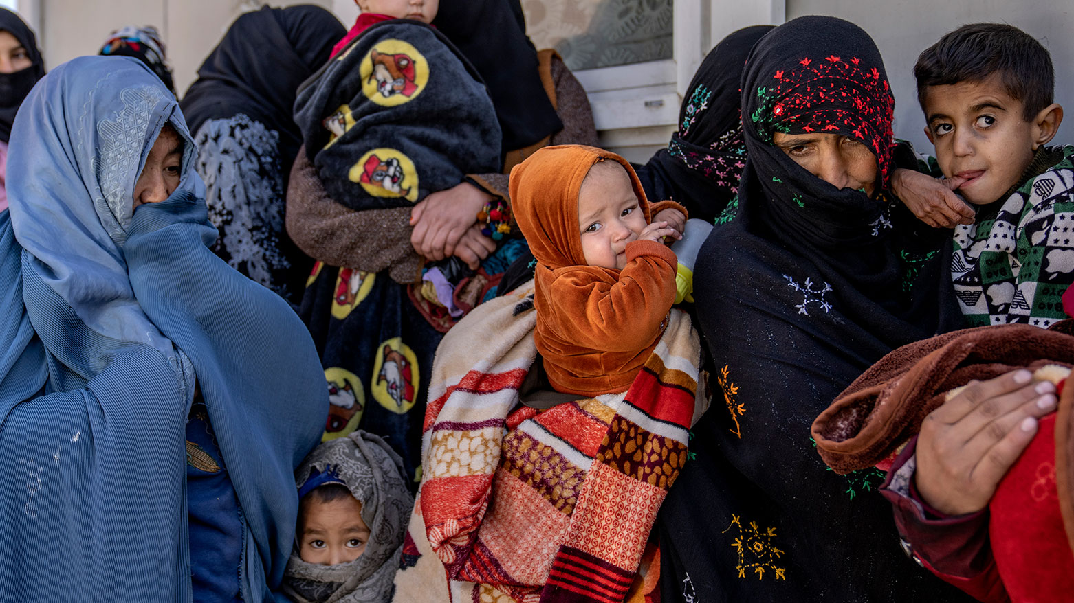 Mothers along with babies who suffer from malnutrition wait to receive help and check-up at a clinic that run by the WFP, in Kabul, Afghanistan, Thursday, Jan. 26, 2023. (Photo: AP)