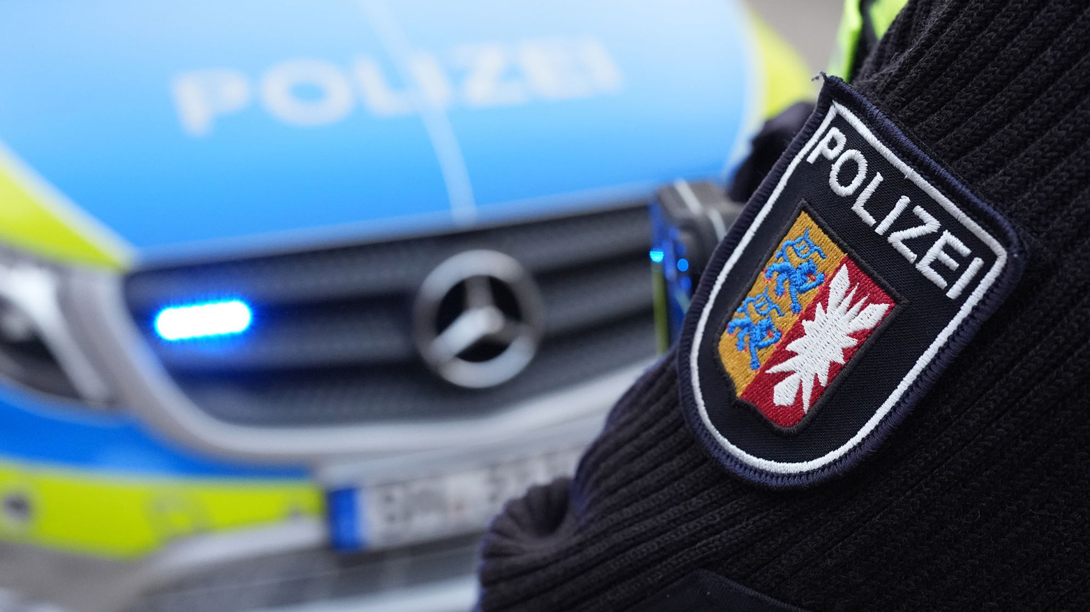 A German Police officer standing in front of his patrol car. (Photo: DPA)