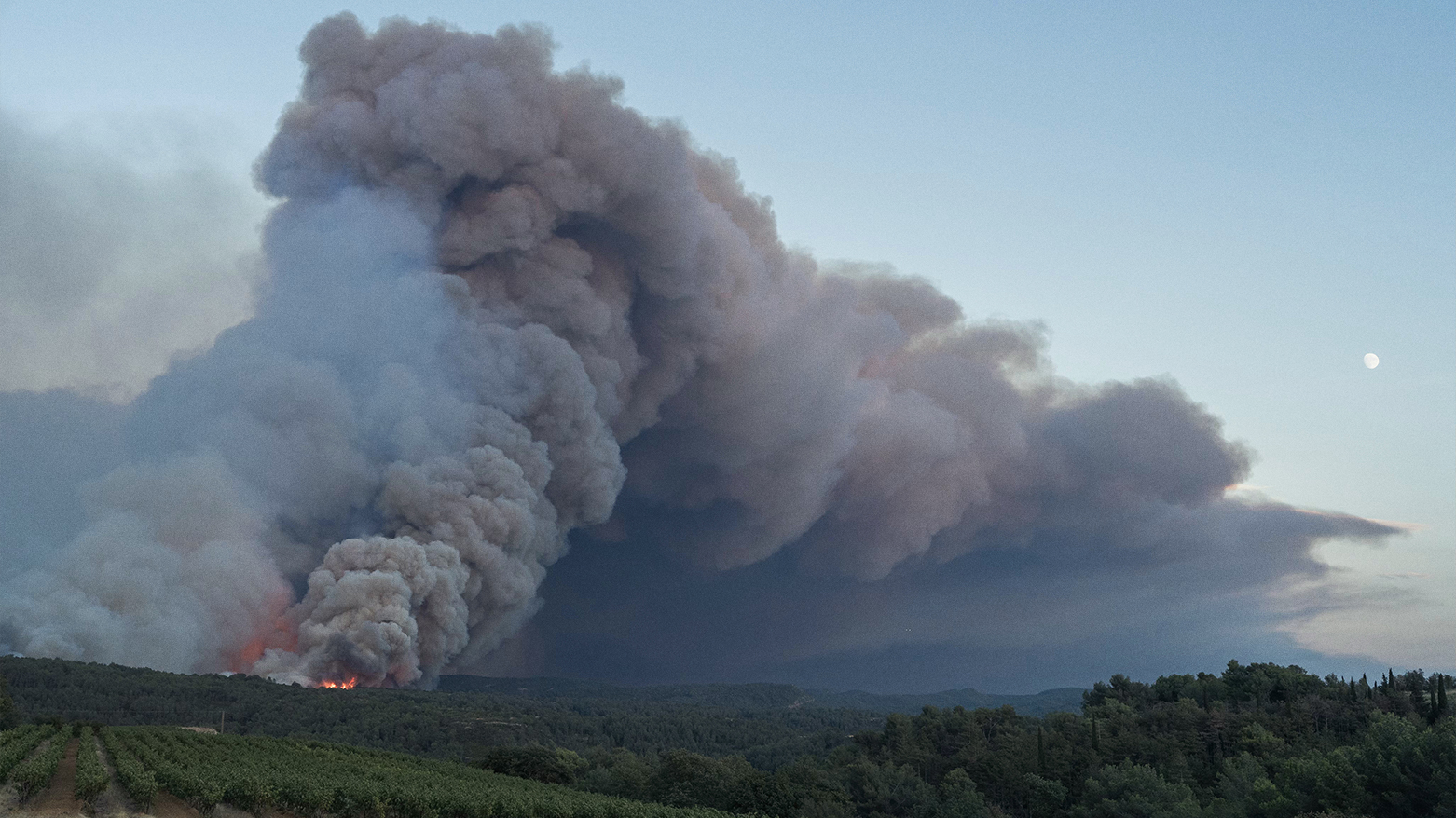 Smoke billows from a forest fire in Jonquières, southwestern France, on August 5, 2025. (AFP)