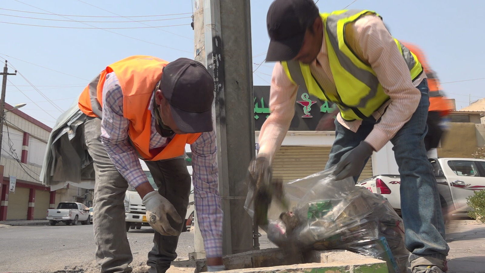 The photo shows Erbil sanitation workers during a cleaning operation. (Photo: Kurdistan24)