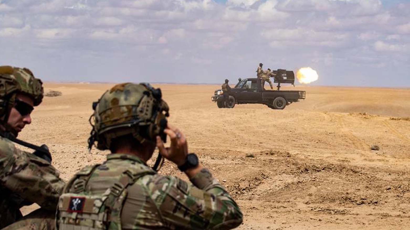 SDF and the US-led coalition troops practise using heavy weapons in north-eastern Syria. (AFP)