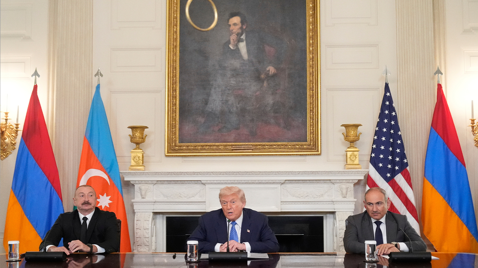 US President Donald Trump participates in a trilateral signing with Azerbaijani President Ilham Aliyev (L) and Armenian Prime Minister Nikol Pashinyan (R). (AP)