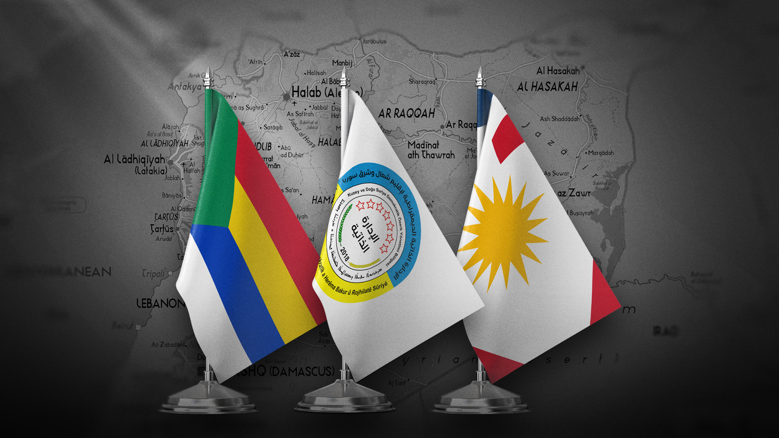 The photo shows symbols of the three ethnic and religious components of Syria, Druze (L), DAANES (C) and Alawites (R). (Photo: Kurdistan24)