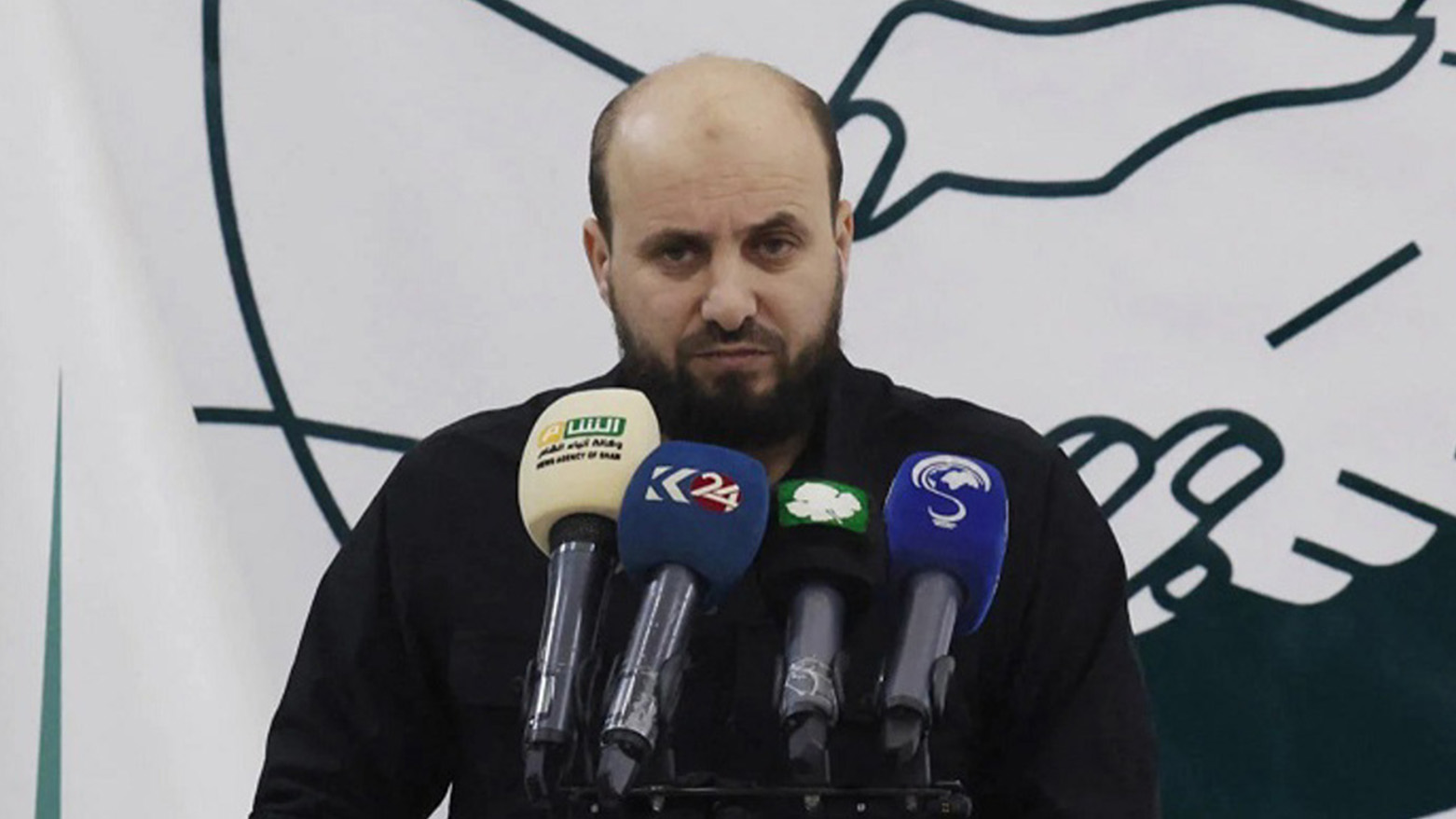 Syria’s Minister of Energy, Mohammed Bashir, holds a press conference in Idlib on 28 Nov. 2024. (AFP)
