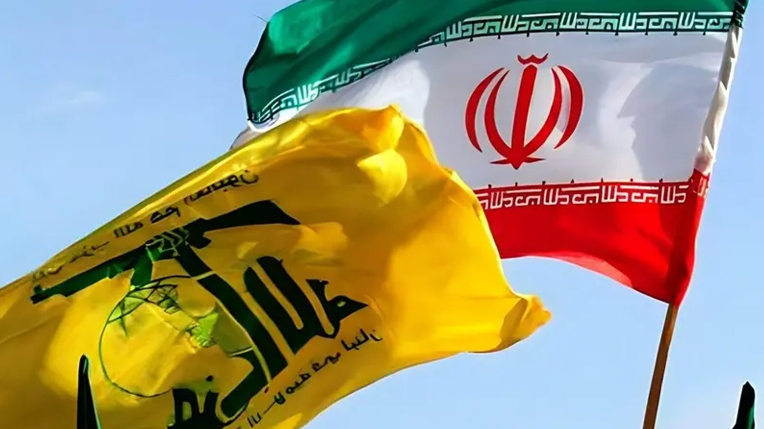 Hezbollah's flag (L), Iran's flag (R). (Tasnim News Agency)